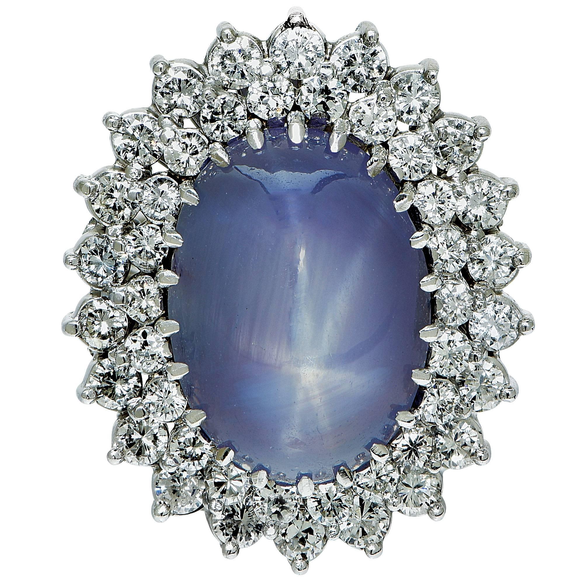 18k white gold ring featuring a cabochon cut star sapphire weighing approximately 27cts accented by 44 round brilliant cut diamonds weighing approximately 2.10cts total G color VS-SI clarity.

Ring size: 8 (can be sized up or down)
Metal weight: