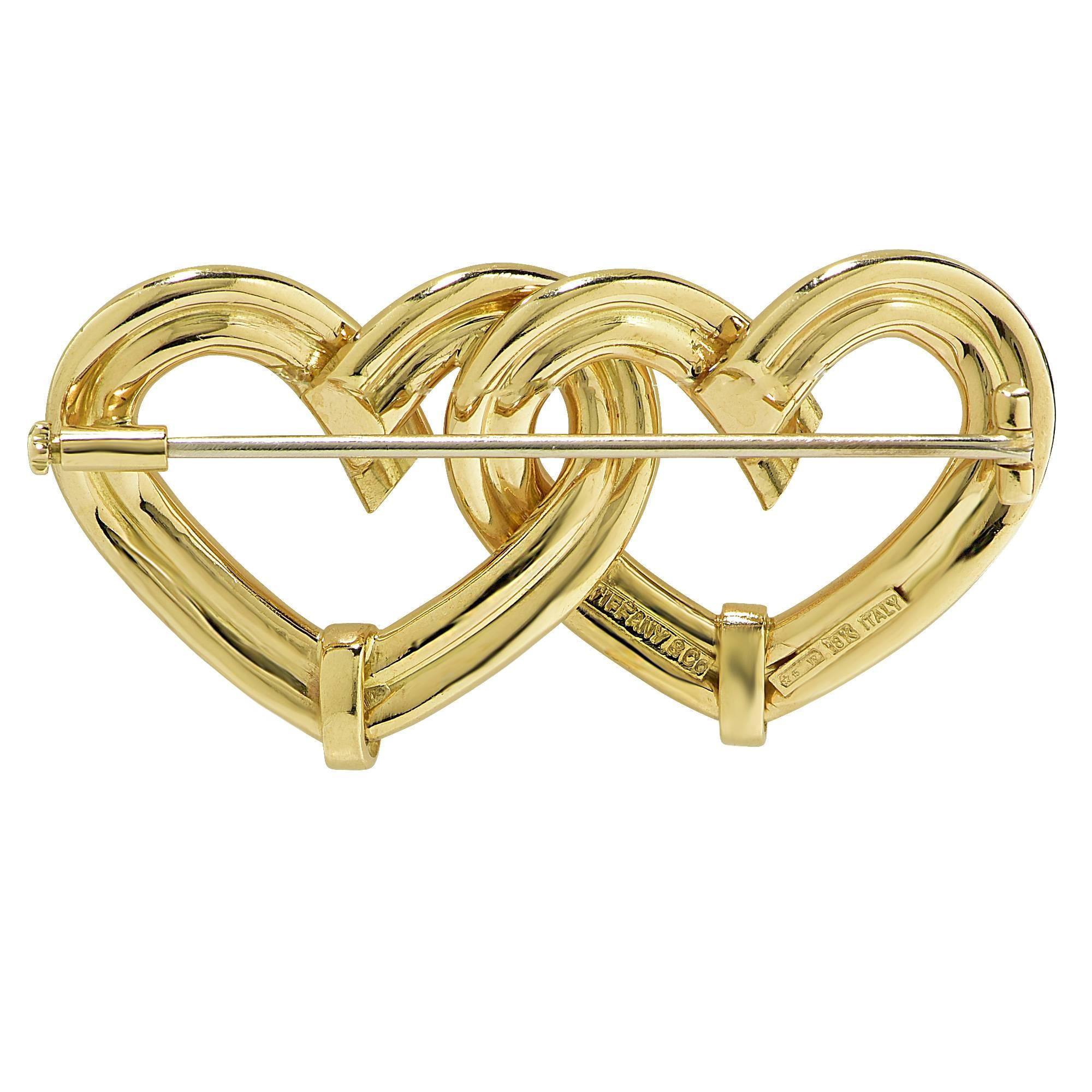 18k yellow Tiffany & Co. double heart brooch.

Metal weight: 13.68 grams

This brooch is accompanied by a retail appraisal performed by a GIA Graduate Gemologist.