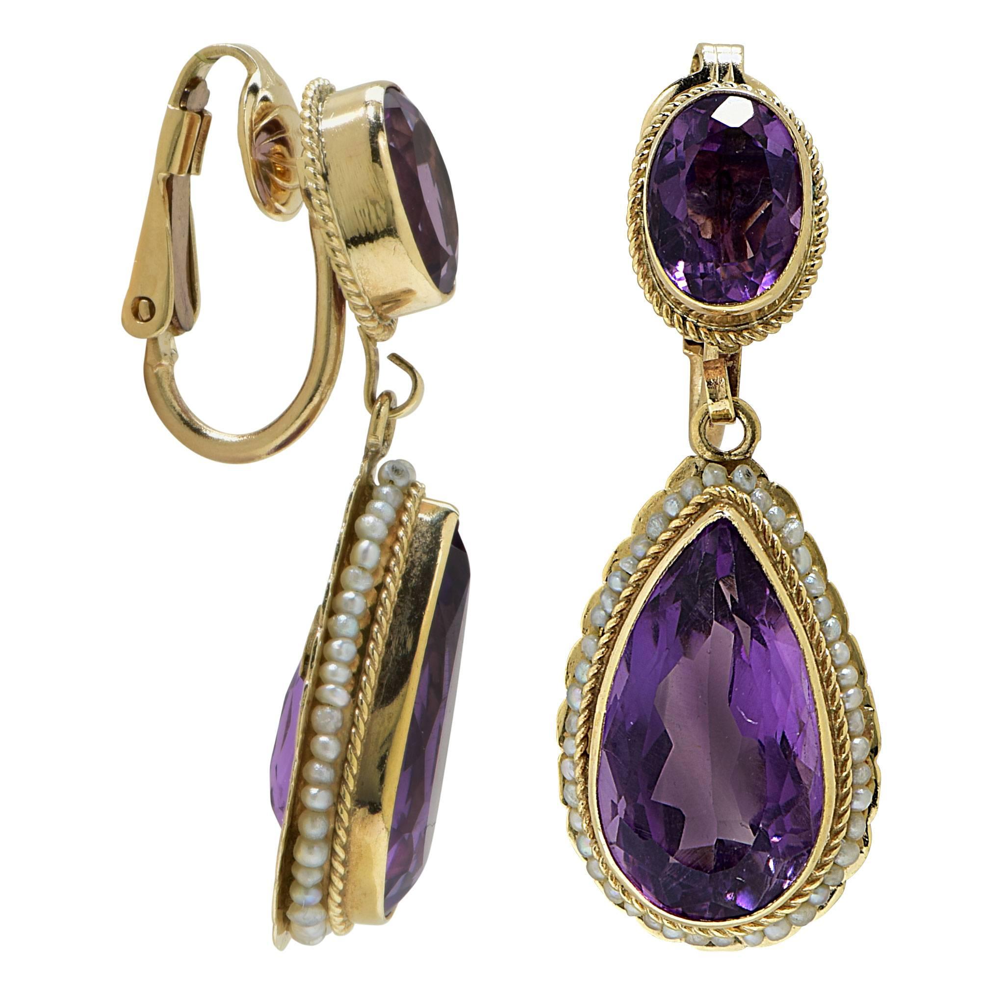 14k yellow gold Amethyst dangle earrings.

Metal weight: 9.01 grams

These earrings are accompanied by a retail appraisal performed by a GIA Graduate Gemologist.