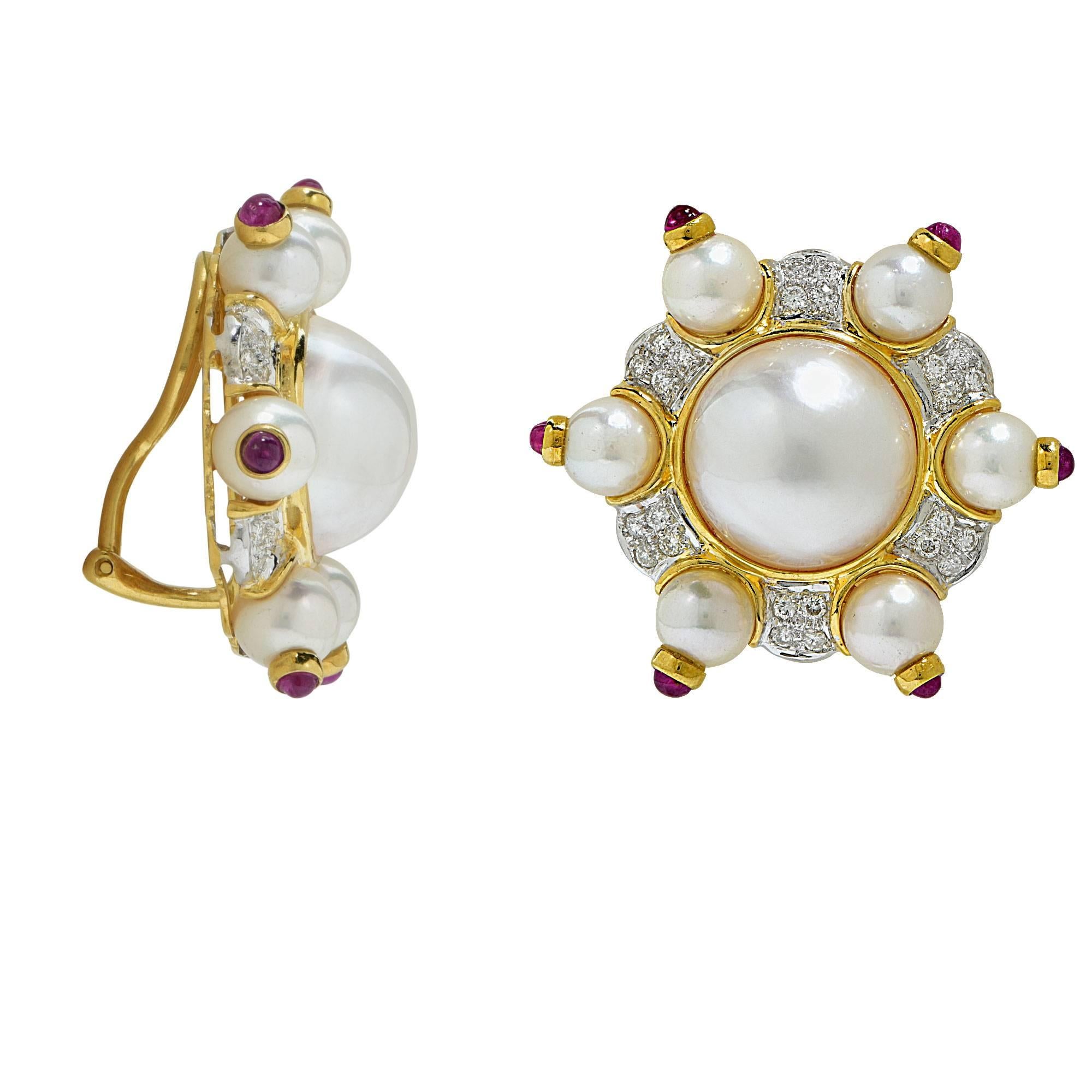 18k yellow gold earrings featuring Mabe pearls, Akoya pearls, approximately 1ct of round brilliant cut diamonds G color VS clarity accented by ruby cabochons.

Metal weight: 26.90 grams

These diamond and pearl earrings are accompanied by a