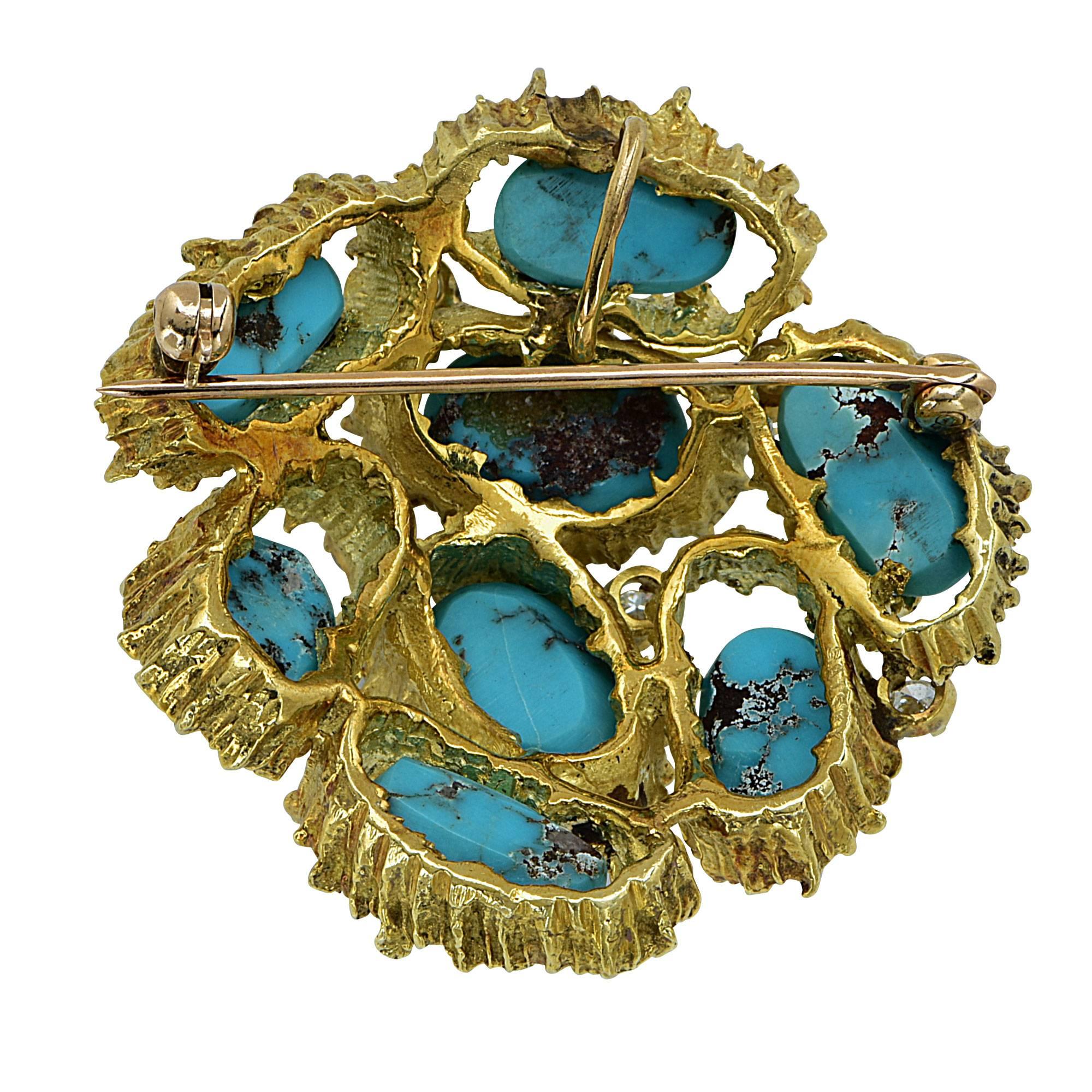 18k yellow gold brooch featuring turquoise cabochons accented by 7 round brilliant cut diamonds weighing approximately .40cts total G color VS clarity.

Metal weight: 31.79 grams

This diamond and turquoise brooch is accompanied by a retail