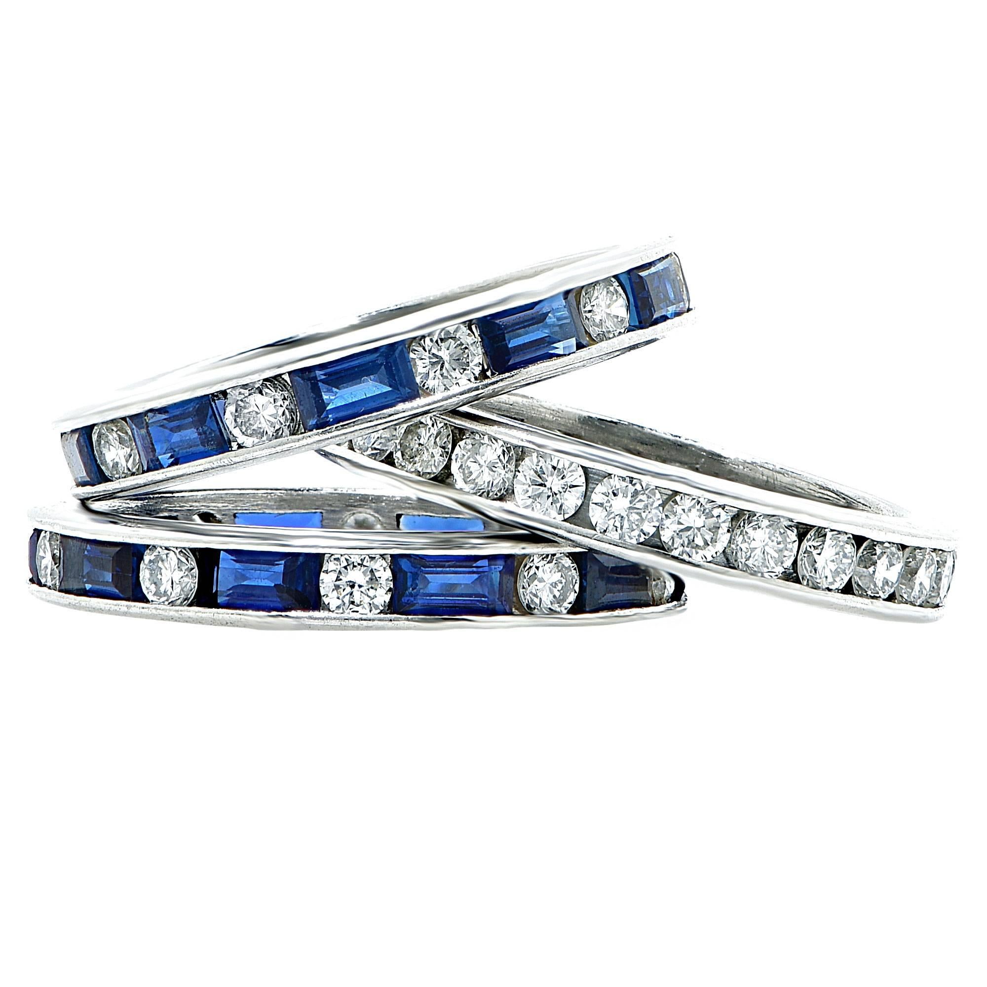 Matching set of 3 Platinum bands. One platinum band featuring 20 round brilliant cut diamonds weighing 1.1cts total, G color VS clarity. Flanked by 2 bands containing alternating sapphires and diamonds. 20 Sapphire baguettes and 20 round brilliant