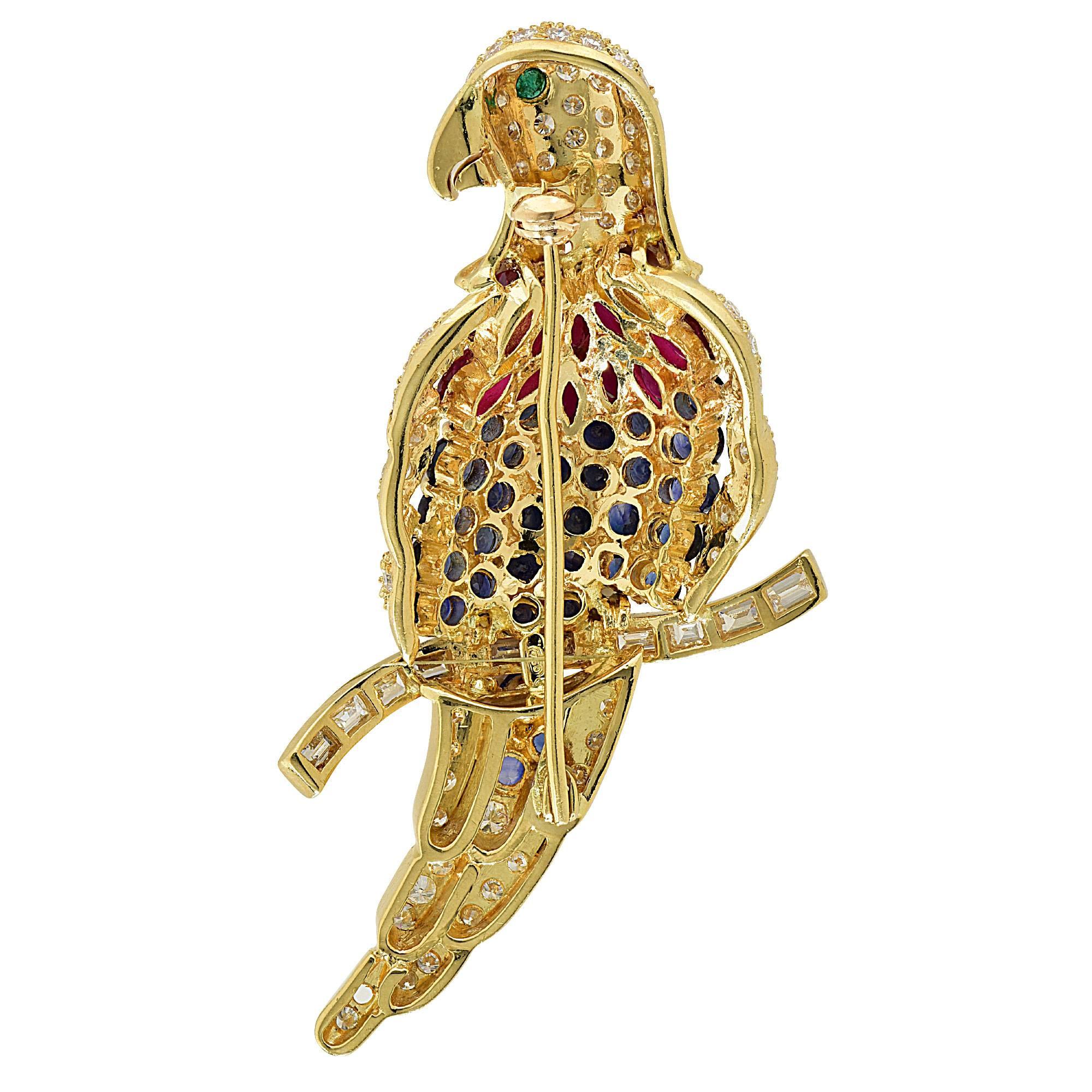 18k yellow gold bird brooch featuring 40 round and marquise cut sapphire and rubies weighing approximately 3.50cts total accented by approximately 3cts of round brilliant and baguette cut diamonds G color VS clarity.

Metal weight: 21.69