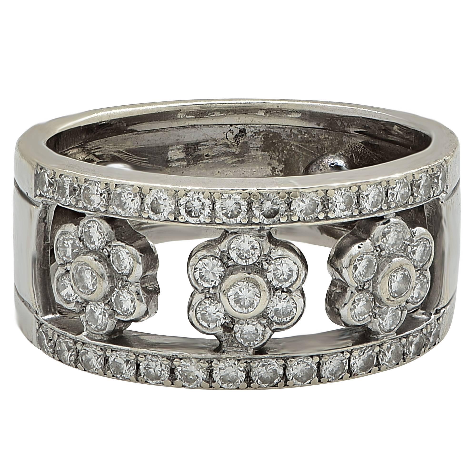 18k white gold band featuring 49 round brilliant cut diamonds weighing approximately .60cts total, G color VS clarity.

Metal weight: 7.79 grams

This diamond band is accompanied by a retail appraisal performed by a GIA Graduate Gemologist.