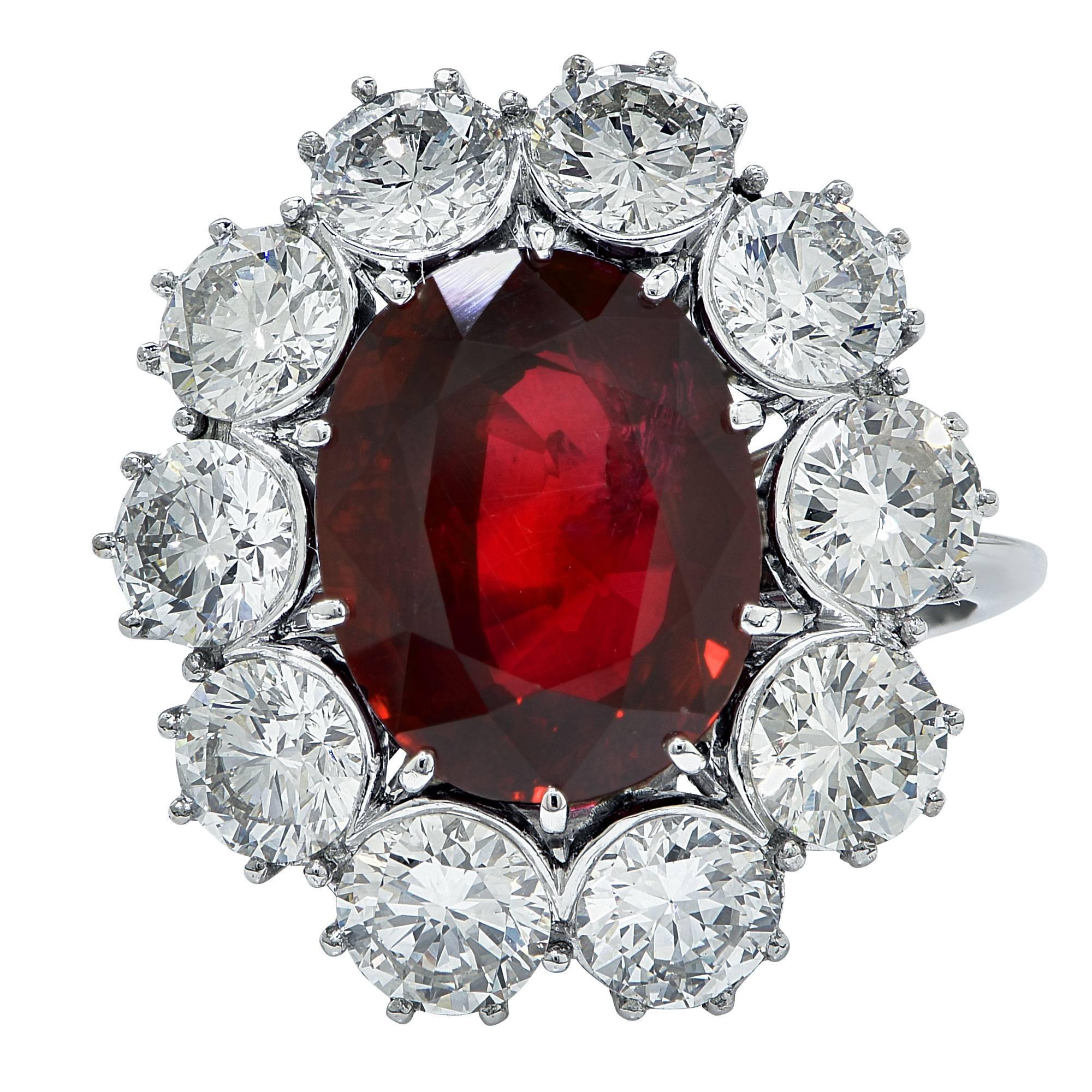 Platinum custom-made ring featuring a 5.52ct oval cut ruby GIA, accented by 11 round brilliant cut diamonds weighing 3.64cts total G color VS clarity.

Ring size: 6 (can be sized up or down)

This ruby and diamond ring is accompanied by a retail
