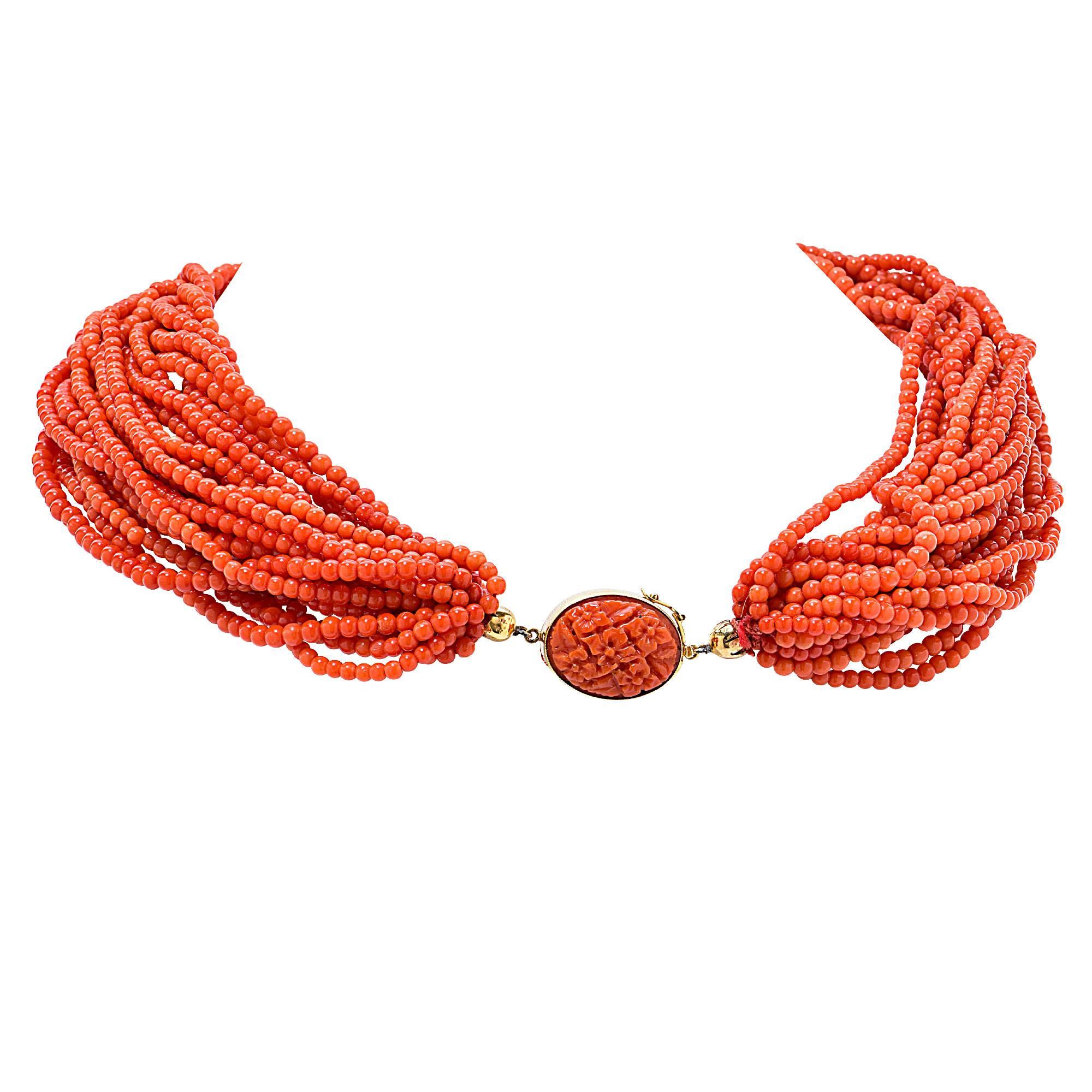 22 strand coral necklace, average 3mm in diameter with a carved coral clasp in 18k yellow gold.

This coral necklace is accompanied by a retail appraisal performed by a GIA Graduate Gemologist.