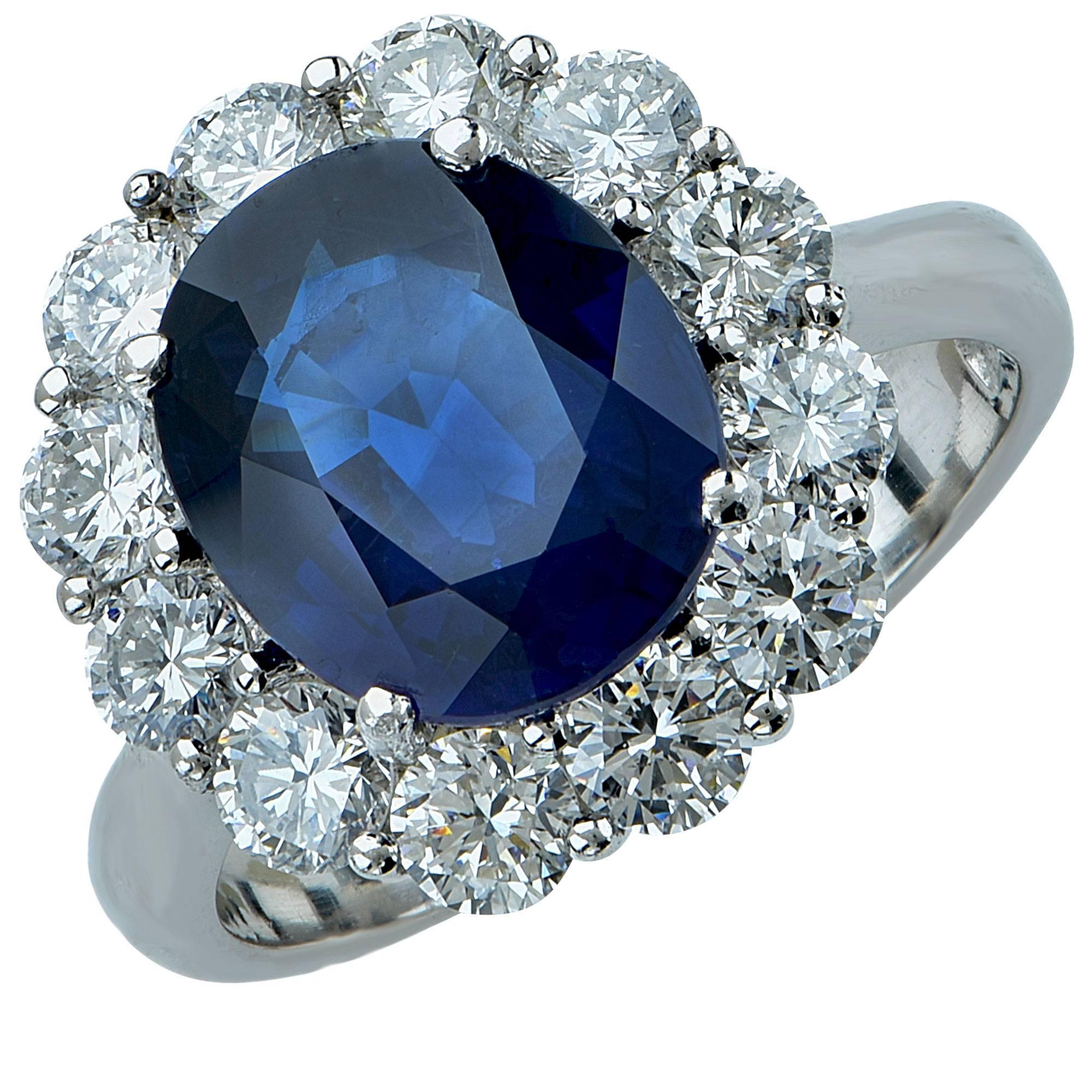 This platinum ring features an AGL graded oval cut sapphire weighing approximately 4.20cts accented by 12 round brilliant cut diamonds weighing approximately 1.80cts total G color VS-SI clarity.

The ring is a size 6.75 and can be sized up or