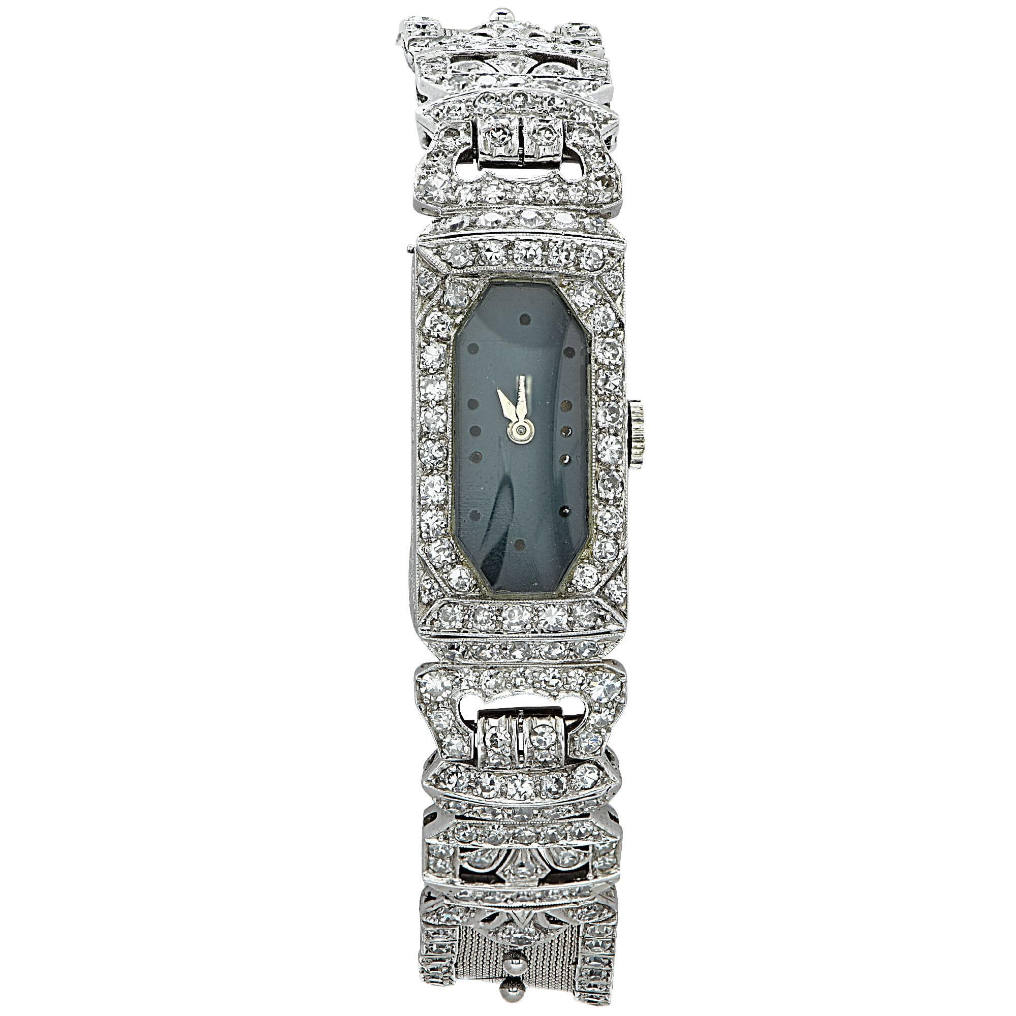 Platinum Art Deco watch featuring approximately 3.5cts of single cut diamonds G color VS clarity.

It is stamped and tested as platinum.
The metal weight is 41.20 grams.
The watch measures 6.10 inches in length by .53 in width by .20 inch in