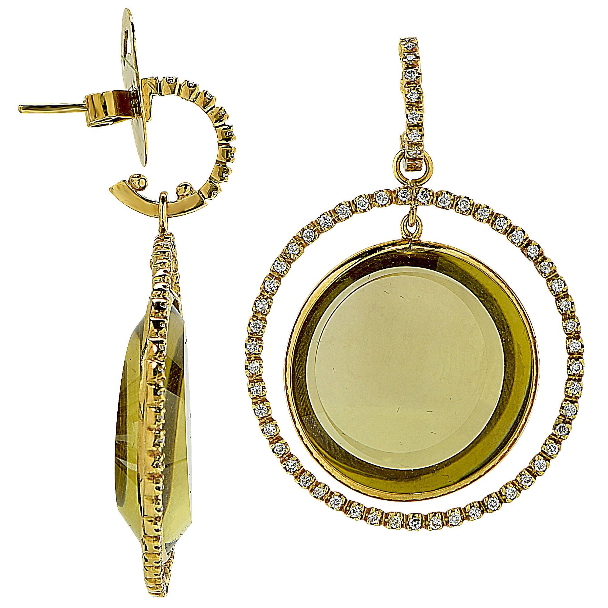 18k yellow gold earrings featuring green quartz accented by 114 round brilliant cut diamonds weighing approximately 1.14cts total, G color SI clarity.

They are stamped and tested as 18k gold.
The metal weight is 20.68 grams.
They measure 1.85
