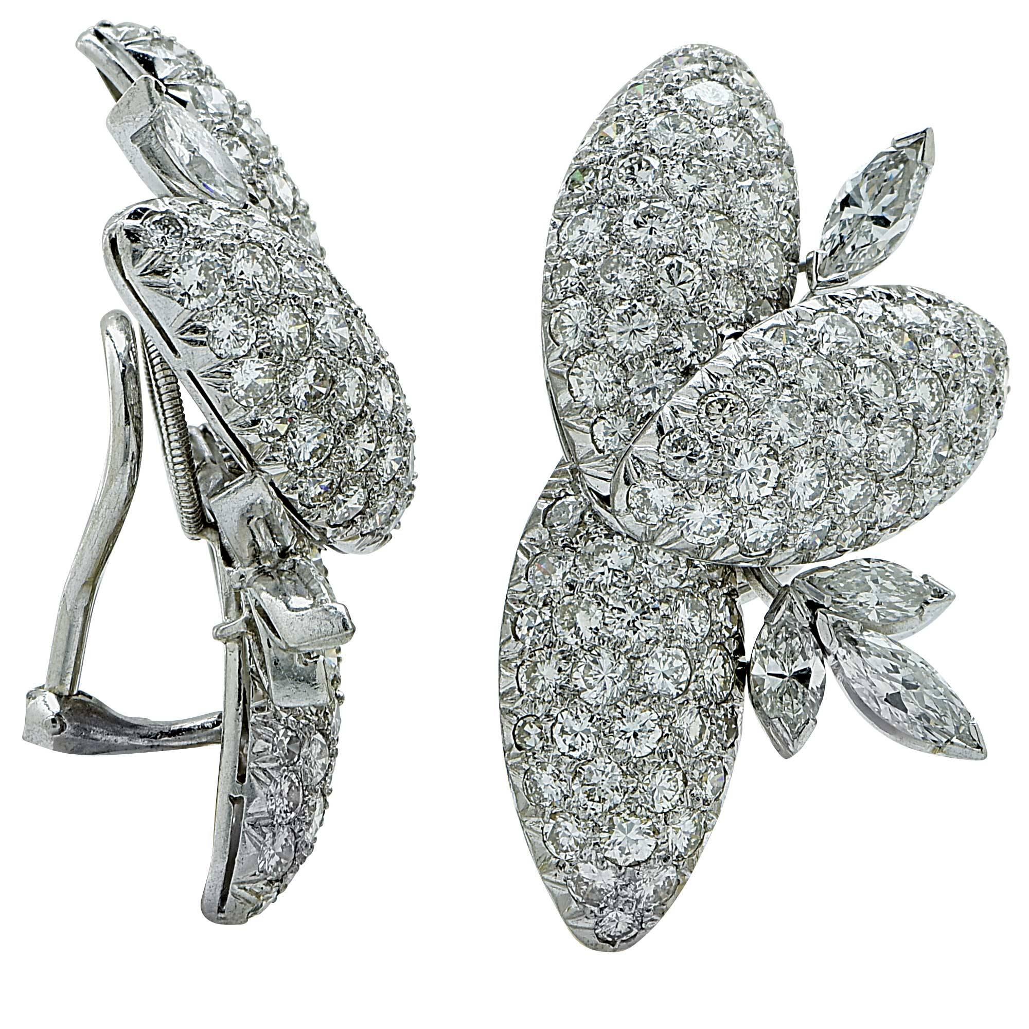 Platinum earrings featuring approximately 198 Round brilliant cut and marquise cut diamonds weighing approximately 11cts F-G color and VS clarity.

They weigh 18.4 grams and are stamped and tested platinum.
These gorgeous earrings measure 36.5mm