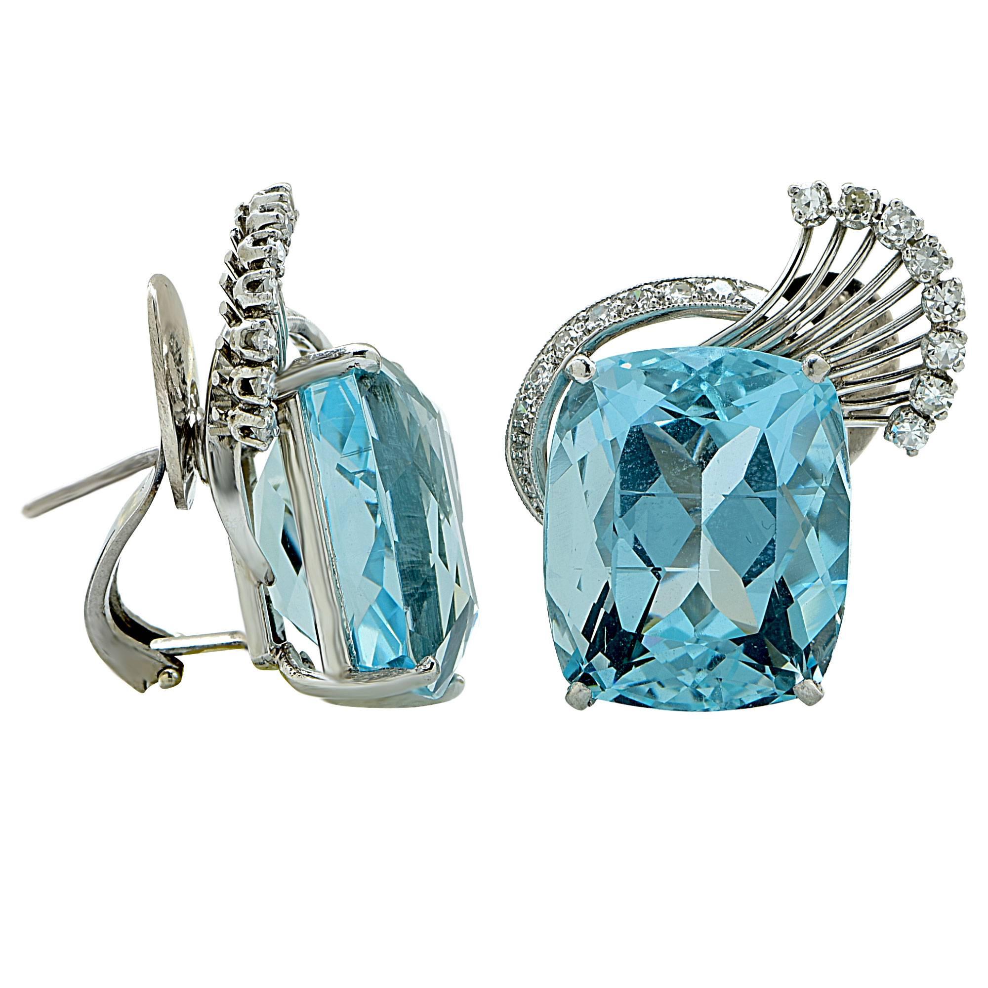 Platinum earrings featuring 2 cushion cut aquamarines weighing approximately 40cts total, accented by 30 single cut diamonds weighing approximately .30cts total, G color VS clarity.

These earrings measure 1.15 inches in height by .82 inch in