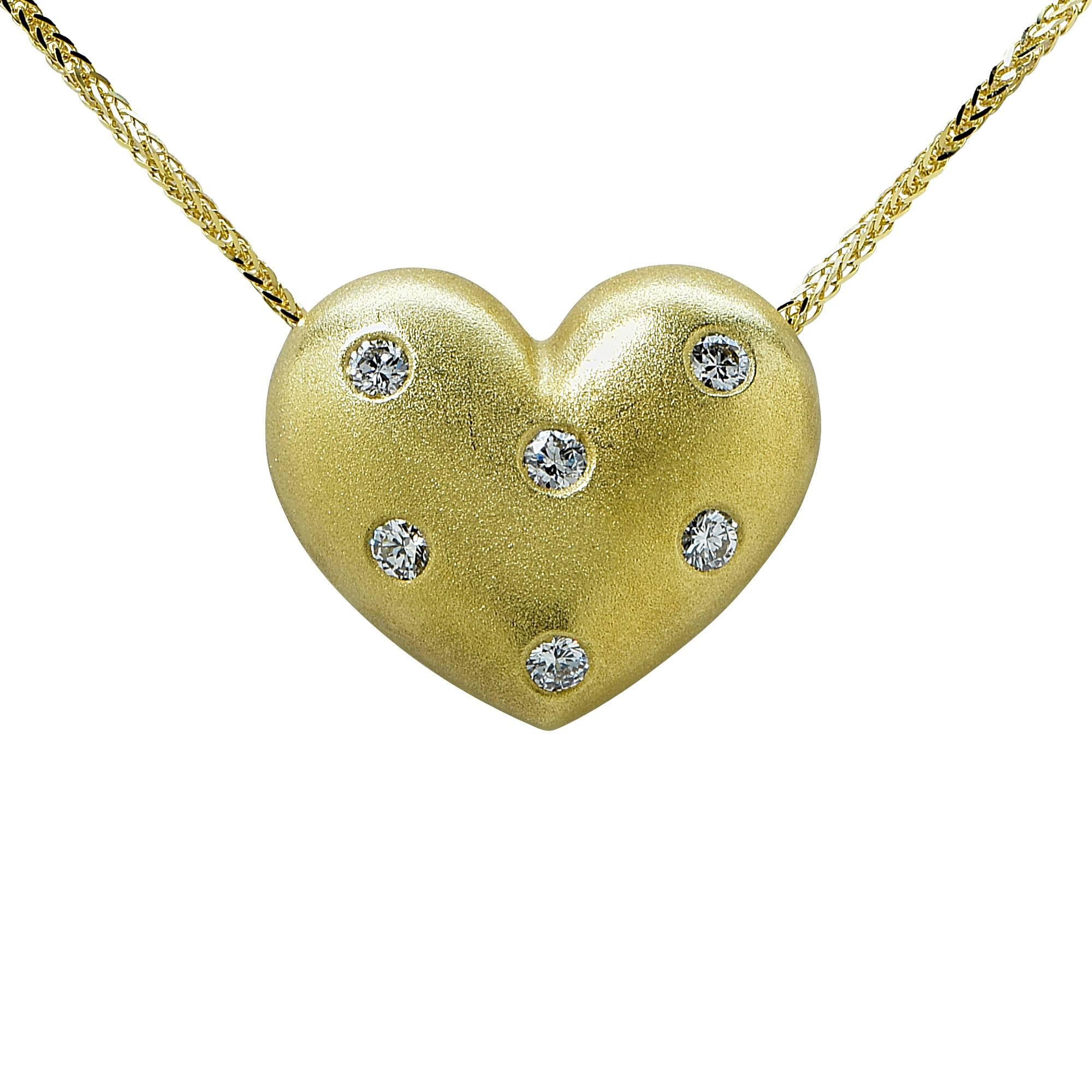 18k yellow gold heart pendant featuring 6 round brilliant cut diamonds weighing approximately .50cts total G color VS clarity on a 14k yellow gold chain.

The necklace is 16 inches in length and the pendent is .75 inch in height by .90 inch in