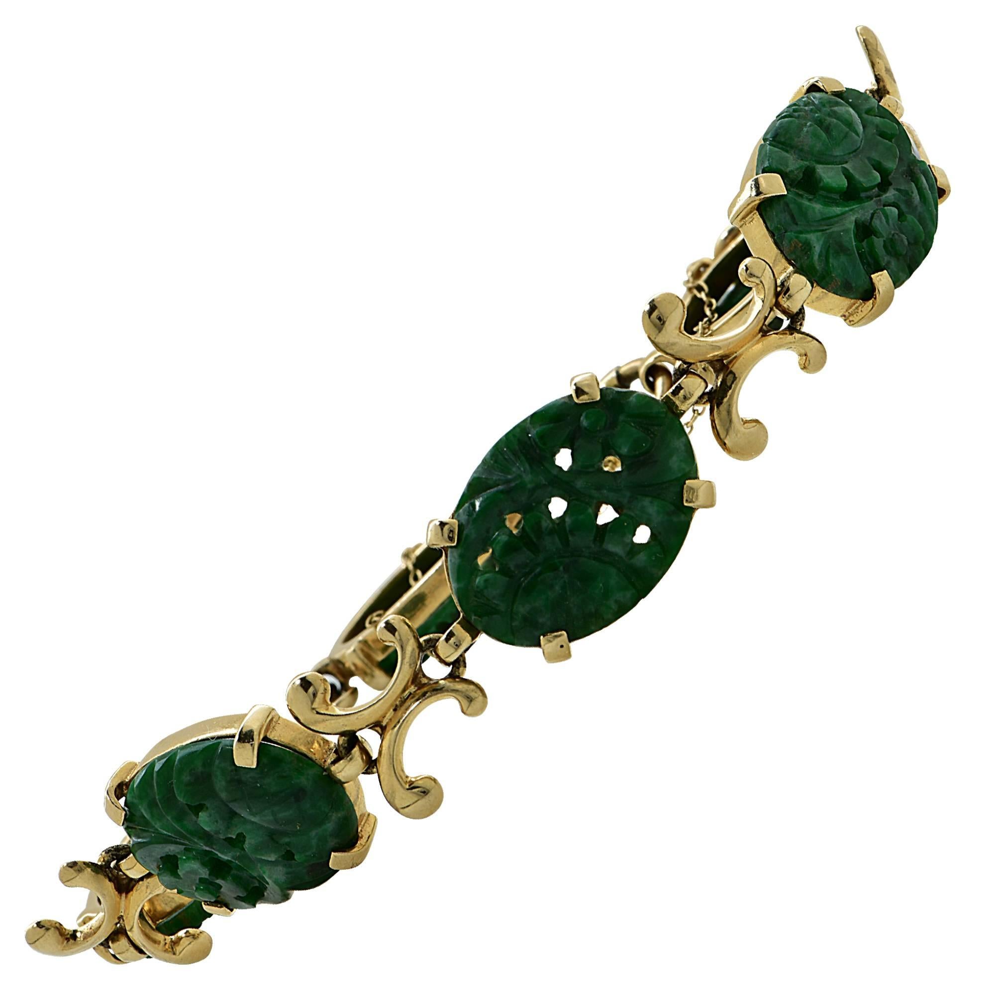 14k yellow gold carved jade bracelet.

The bracelet is 7 inches in length and .52 inch in width.
It is stamped and tested as 14k gold.
The metal weight is 21.22 grams.

This jade bracelet is accompanied by a retail appraisal performed by a