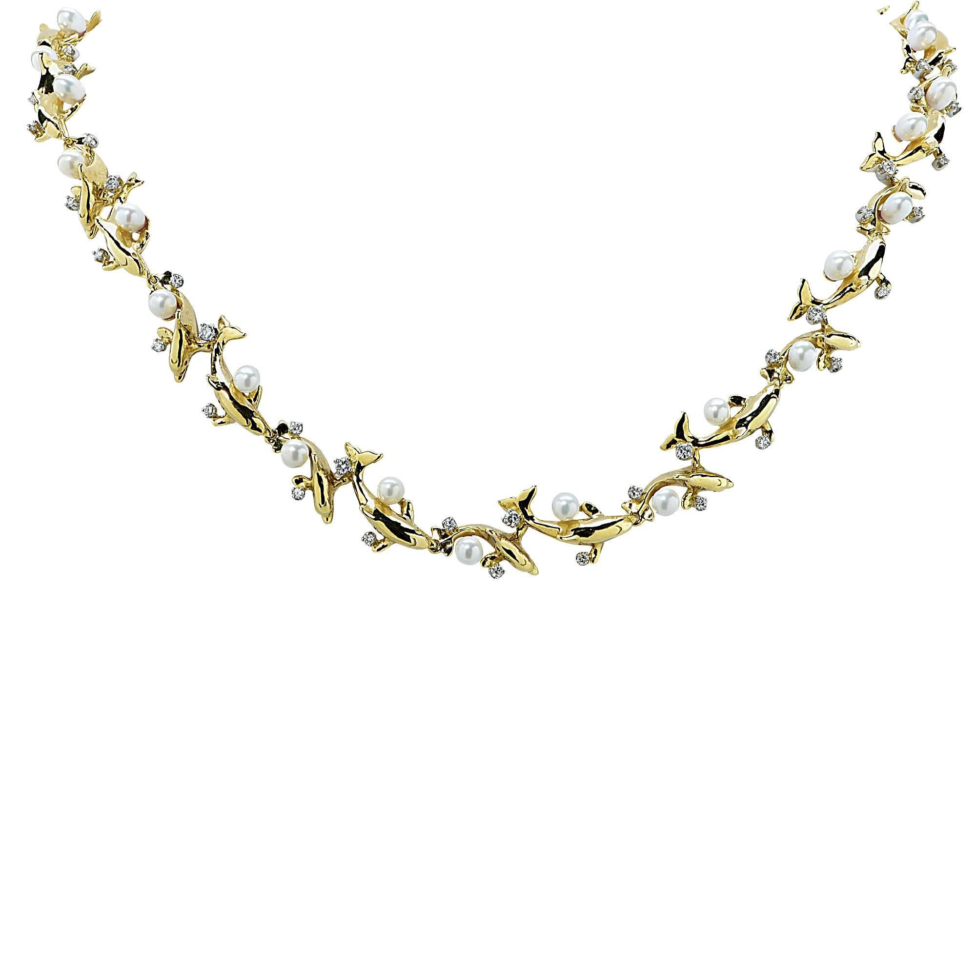 18k yellow gold limited edition Wyland necklace number 37 of 250 featuring cultured pearls 4.2mm accented by 36 round brilliant cut diamonds weighing approximately 1cts total G color VS clarity.

The necklace measures 39 inches in length by .50