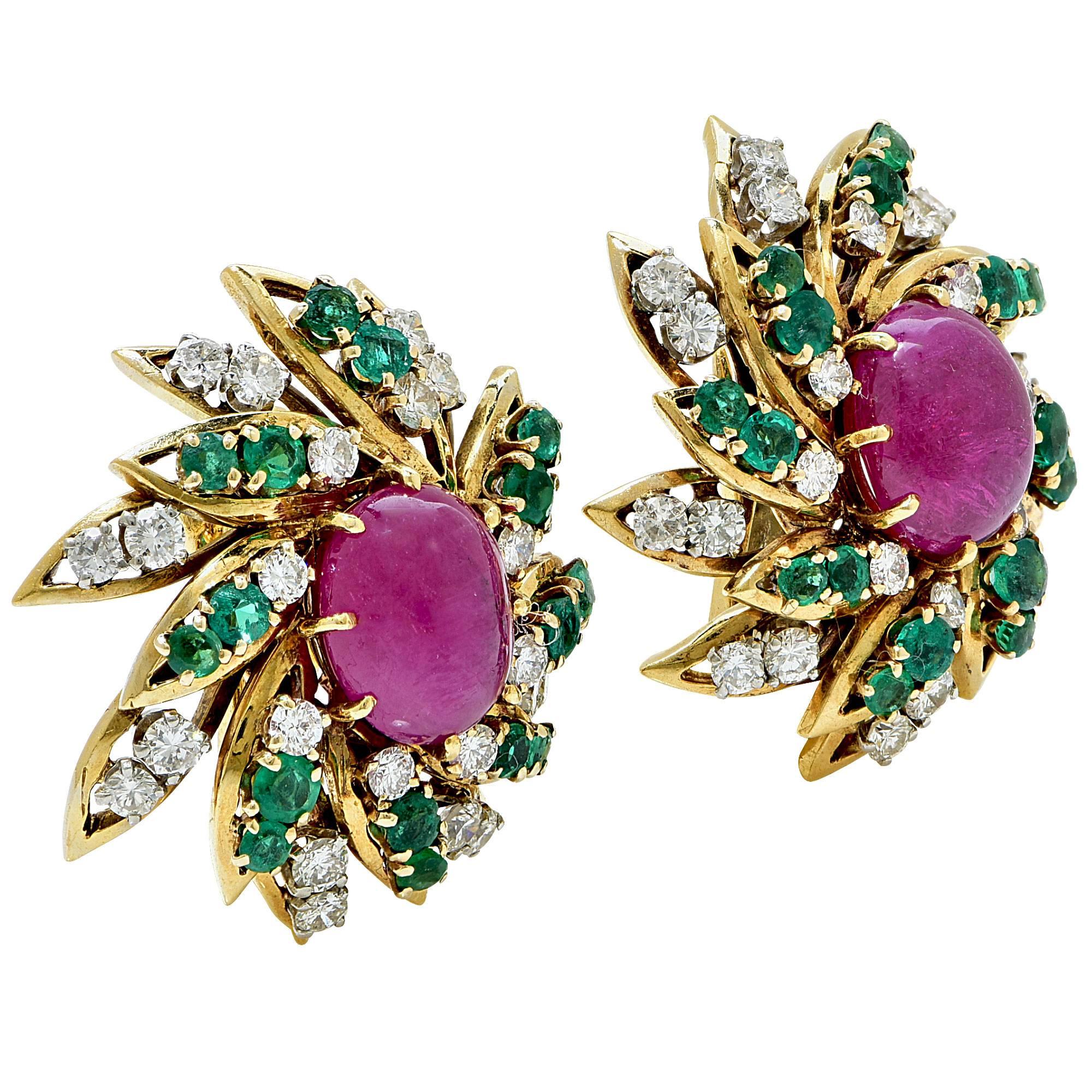 18k yellow gold Webb earrings featuring 2 cabochons Rubies weighing approximately 12cts total, accented by 1.4cts of round cut Emeralds and 48 round brilliant cut diamonds weighing approximately 3cts total, G color VS clarity.

These earrings