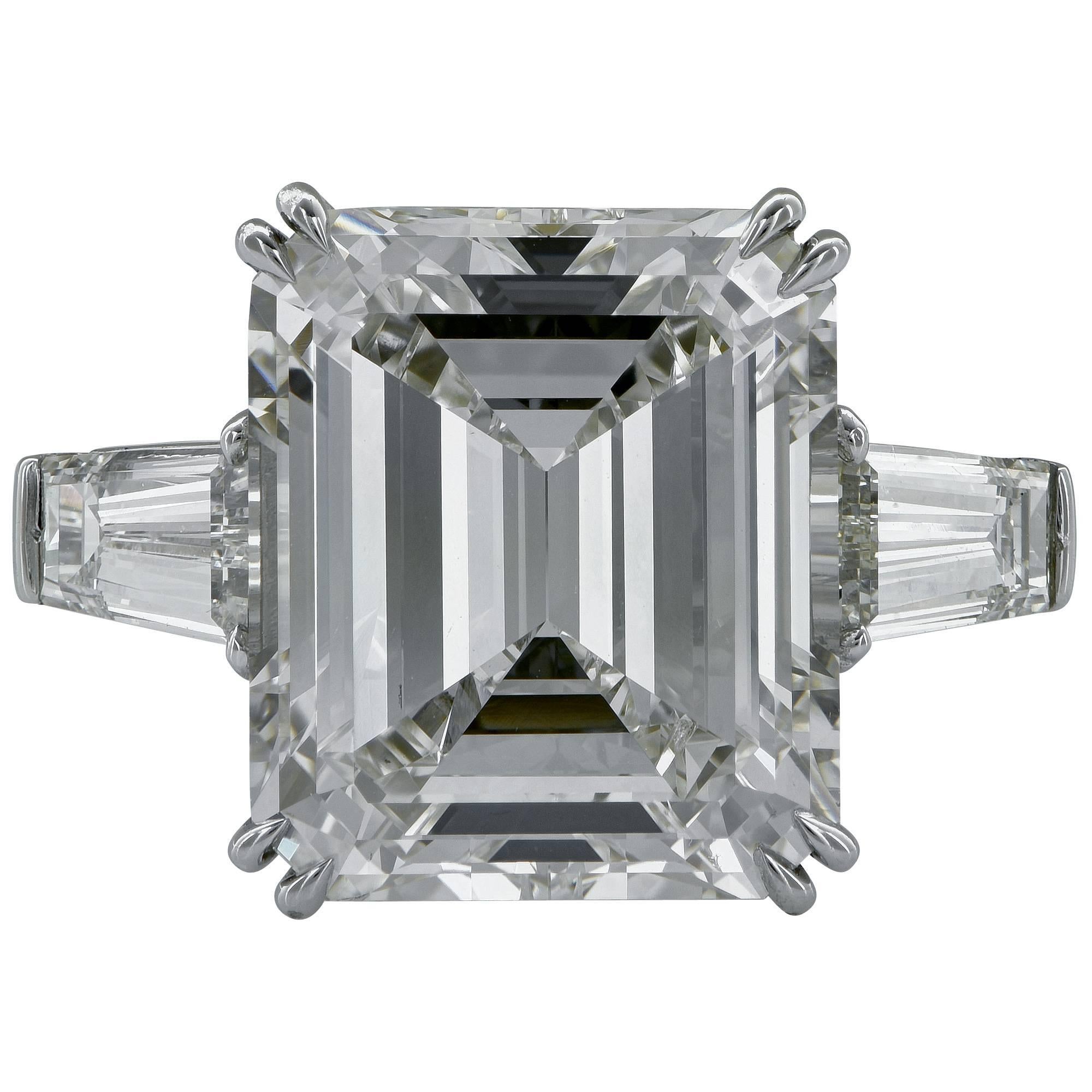 This stunning platinum handmade ring features a 9.17ct emerald cut diamond K color and VS1 clarity and is flanked by 2 tapered baguettes weighing 1.63ct total J color and VS clarity.

This ring is a size 6.25 and can be sized up or down.
It is
