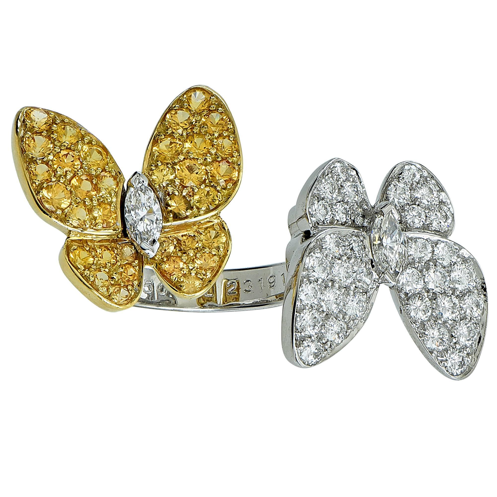 Authentic Van Cleef and Arpels two butterfly between the finger ring from the flying beauties collection. This unique ring features .99cts of D-F color, Internally flawless to VVS clarity round brilliant and marquise cut diamonds accented by .88