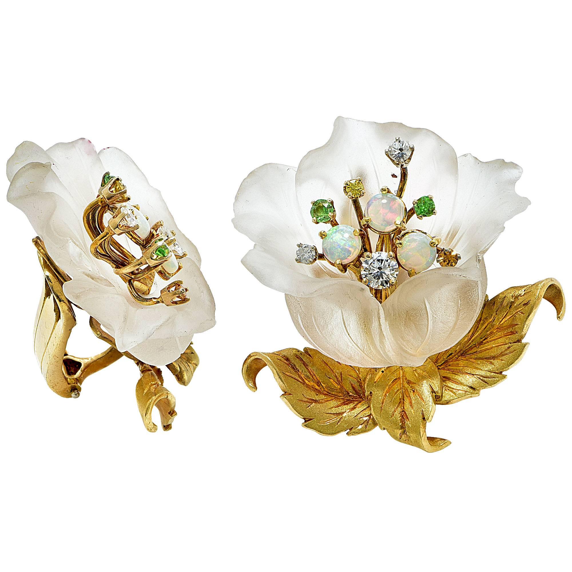 18k yellow gold earrings made of carved rock crystal petals accented by 10 round brilliant cut and sigle cut diamonds weighing approximately .70cts as well as 4 demantoid garnets and 9 cabochon opals.

These earnings are a work of art and measure