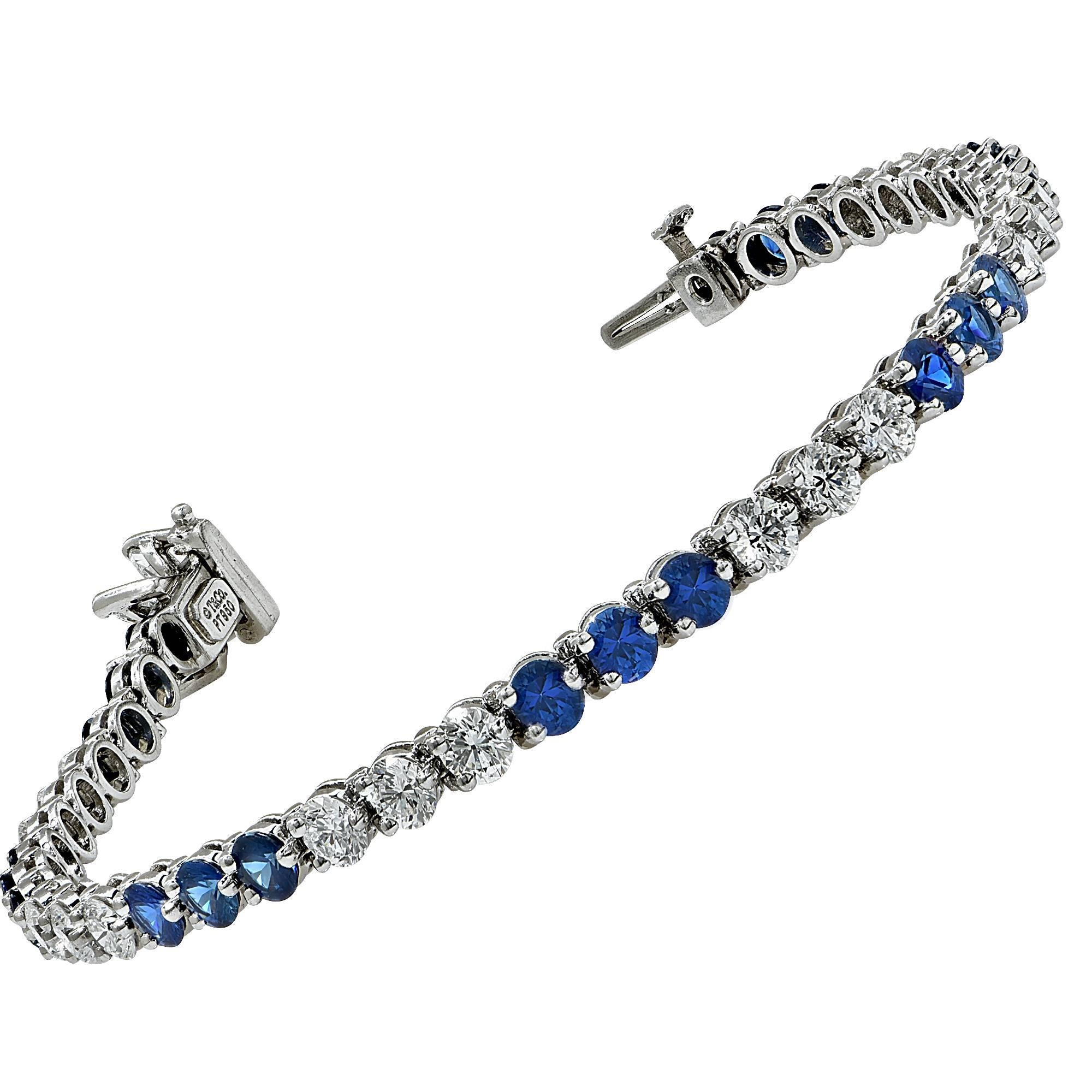 Authentic Tiffany & Co. Victoria line bracelet containing 18 Round brilliant cut diamonds weighing approximately 2.70ct F color and VVS-VS clarity and 21 vibrant round blue sapphires weighing approximately 4cts. The clasp contains 4 marquise cut