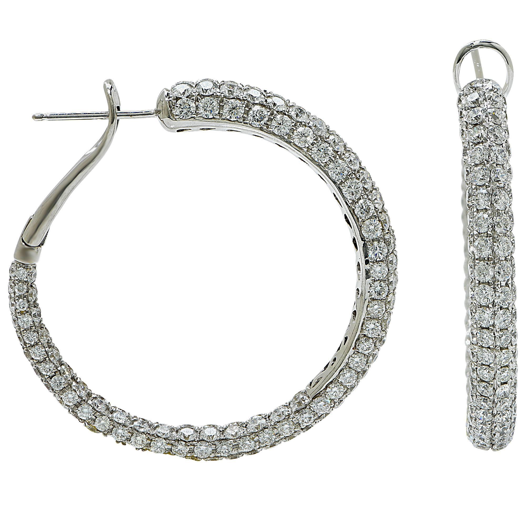 18k white gold hoop earrings featuring approximately 10cts of round brilliant cut diamonds G color VS clarity.

The earrings measure 1.49 inch in height by .17 inch in width by 1.44 inch in depth.
It is stamped and tested as 18k gold.
The metal