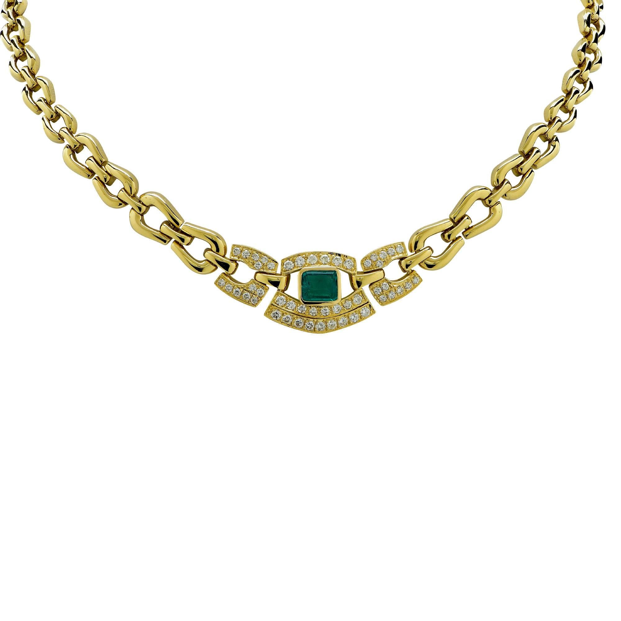 18k yellow gold necklace featuring a Colombian Emerald weighing approximately 1.5cts accented by 49 round brilliant cut diamonds weighing approximately .90cts total, G color VS clarity.

The necklace measures 
It is stamped and tested as 18k