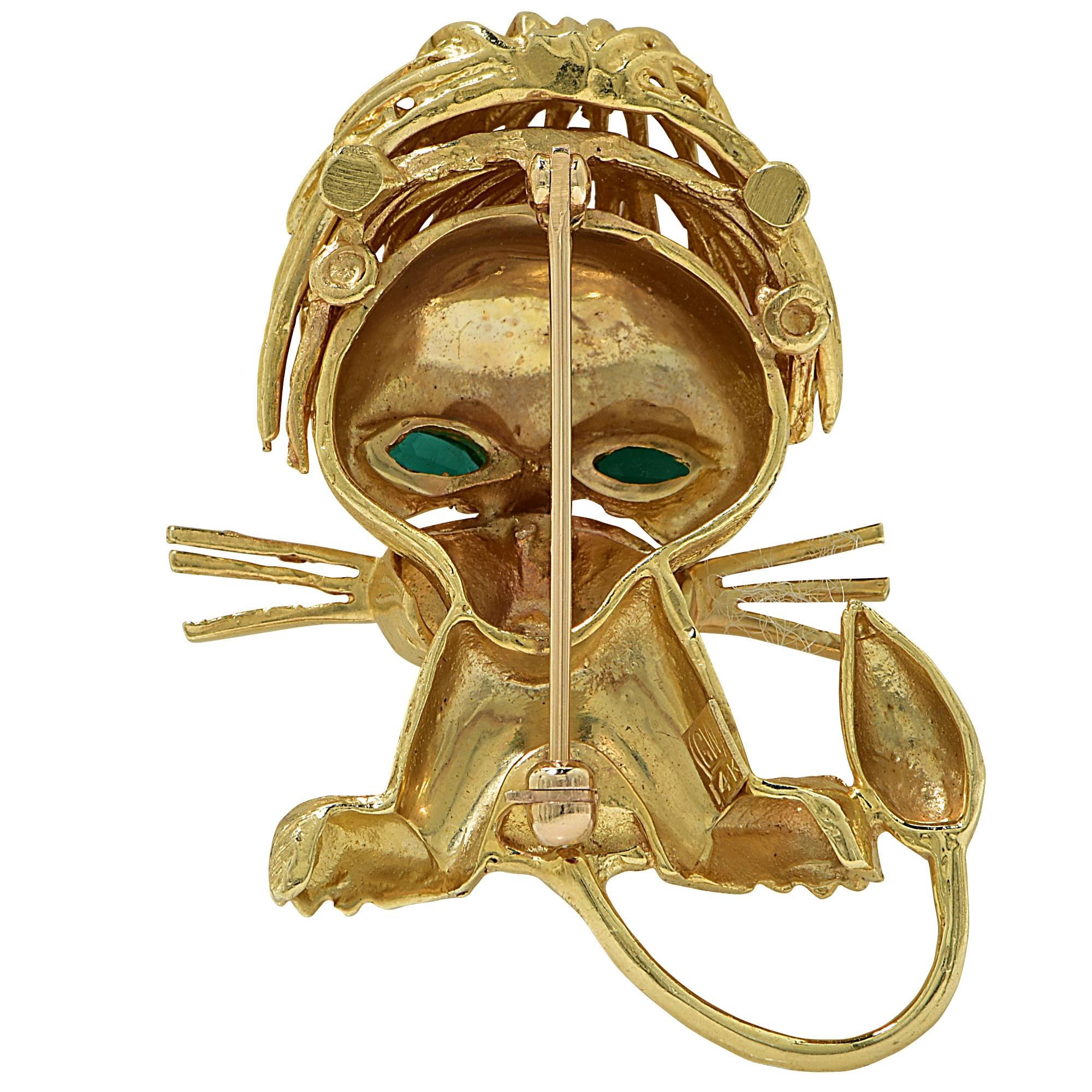 14k yellow gold Lion brooch featuring synthetic emerald and synthetic ruby eyes and nose.

It is stamped and tested as 14k gold.
The metal weight is 14.77 grams.

This brooch is accompanied by a retail appraisal performed by a GIA Graduate