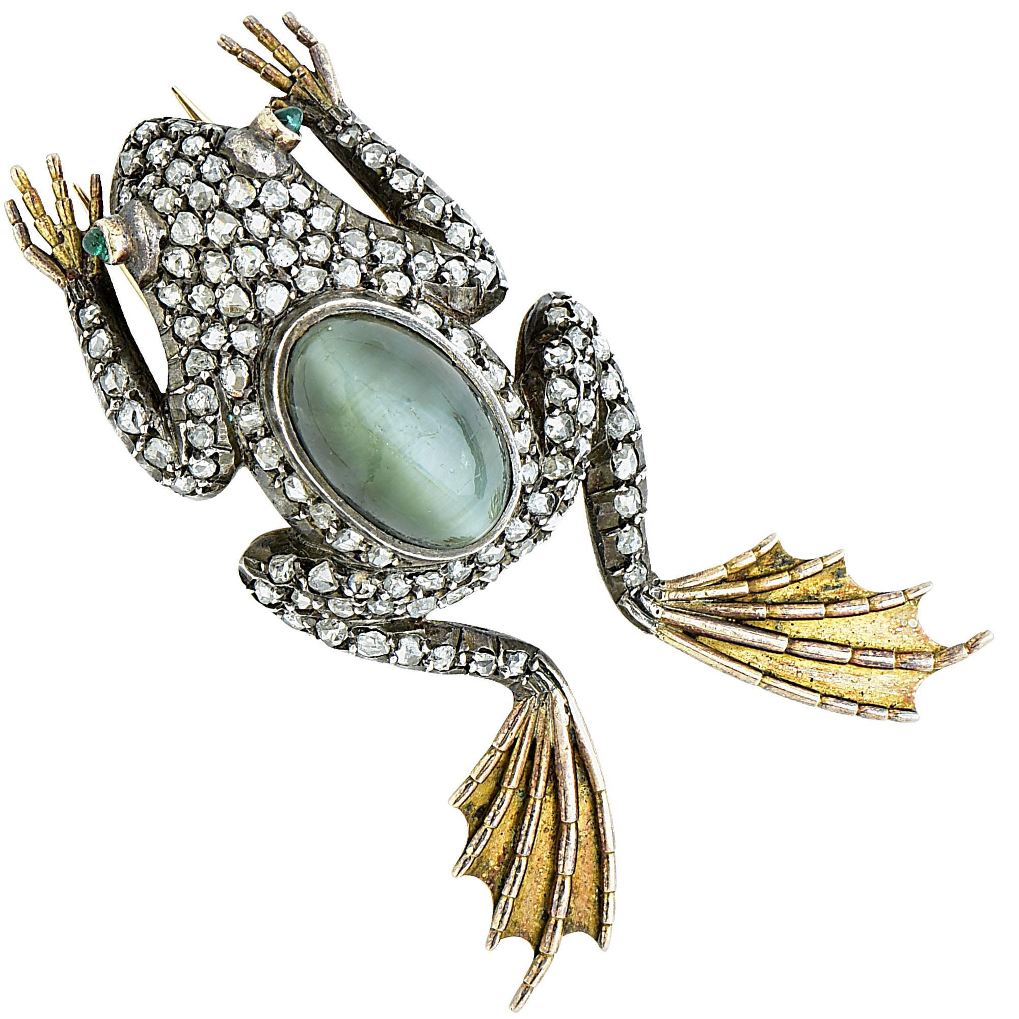 Victorian silver over gold frog brooch featuring 111 rose cut diamonds weighing approximately 1.70cts total, G color VS-SI clarity.

The metal weight is 13.52 grams.

This diamond brooch is accompanied by a retail appraisal performed by a GIA