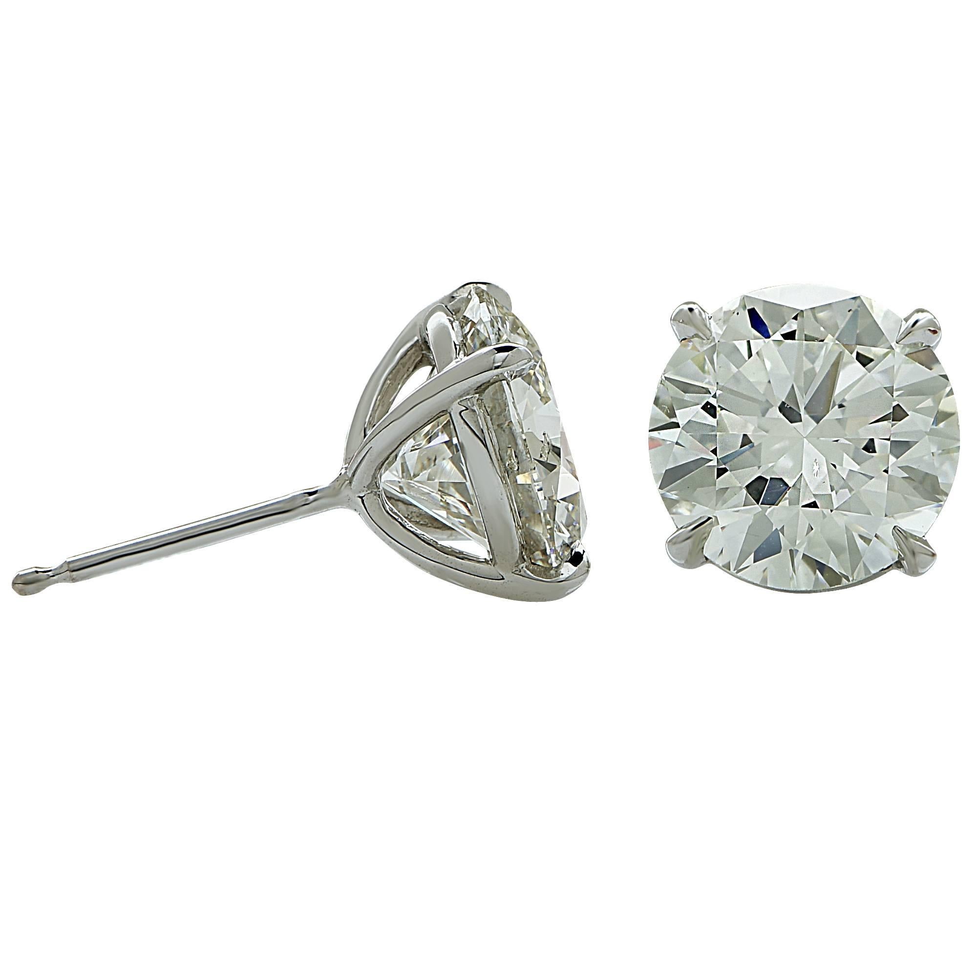 18k white gold earrings featuring a 2.26ct K color Si2 clarity and a 2.14ct K color and SI1 clarity. Both diamonds are accompanied by GIA reports (images attached).

It is stamped and tested as 18k gold.
The metal weight is 1.58 grams.

These