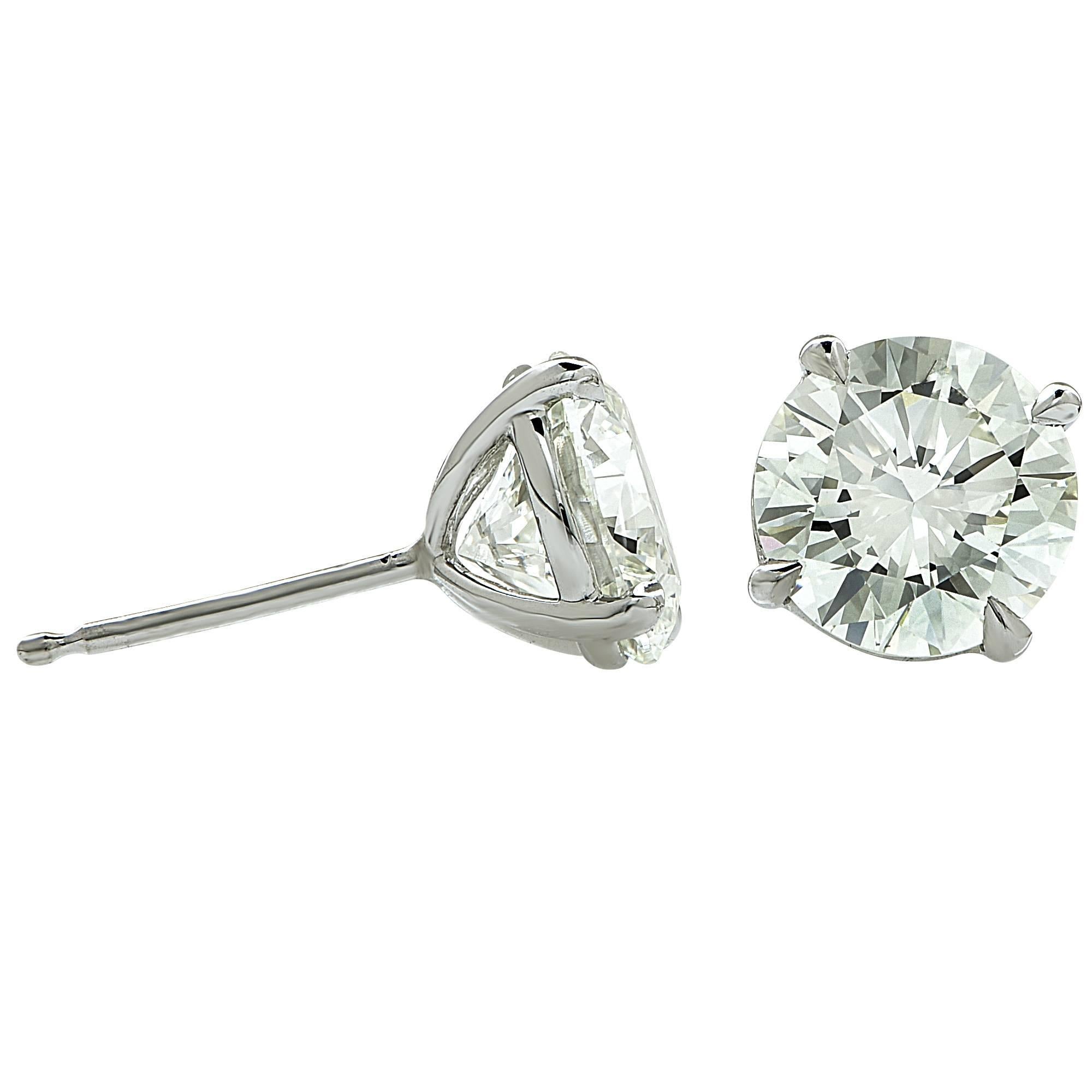 18k white gold earrings containing 2 round brilliant cut diamonds with GIA reports (images attached). The diamonds have a combined total weight of 2.86cts K-L color and VVS clarity.

It is stamped and tested as 18k gold.
The metal weight is 1.58