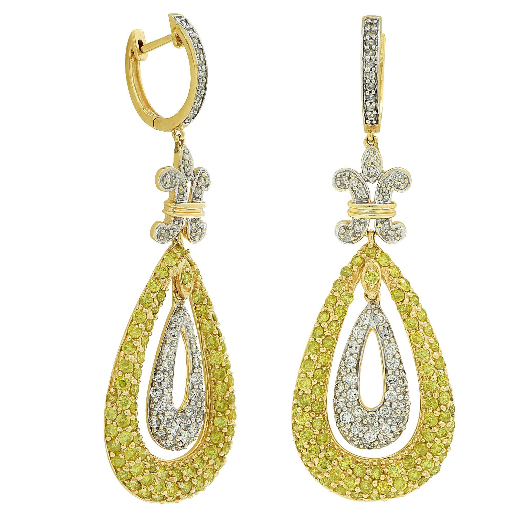 14k white and yellow gold earrings featuring 112 round brilliant cut diamonds weighing approximately 1.25cts total G color I1 clarity accented by 166 round brilliant cut irradiated yellow diamonds I1 clarity.

The earrings measure 2.24 inch by .77