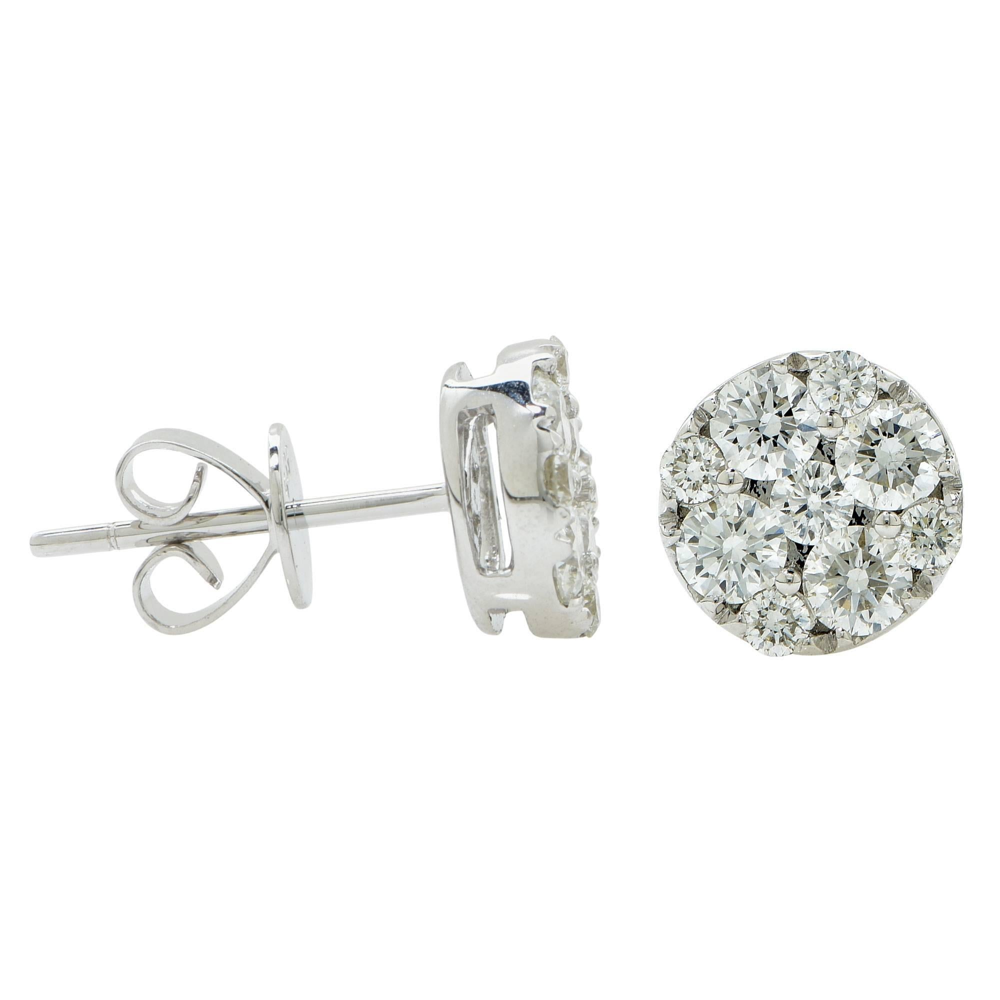 14k white gold cluster stud earrings featuring 18 round brilliant cut diamonds weighing 1ct total G color VS clarity.

It is stamped and tested as 14k gold.
The metal weight is 1.86 grams.

These diamond earrings are accompanied by a retail