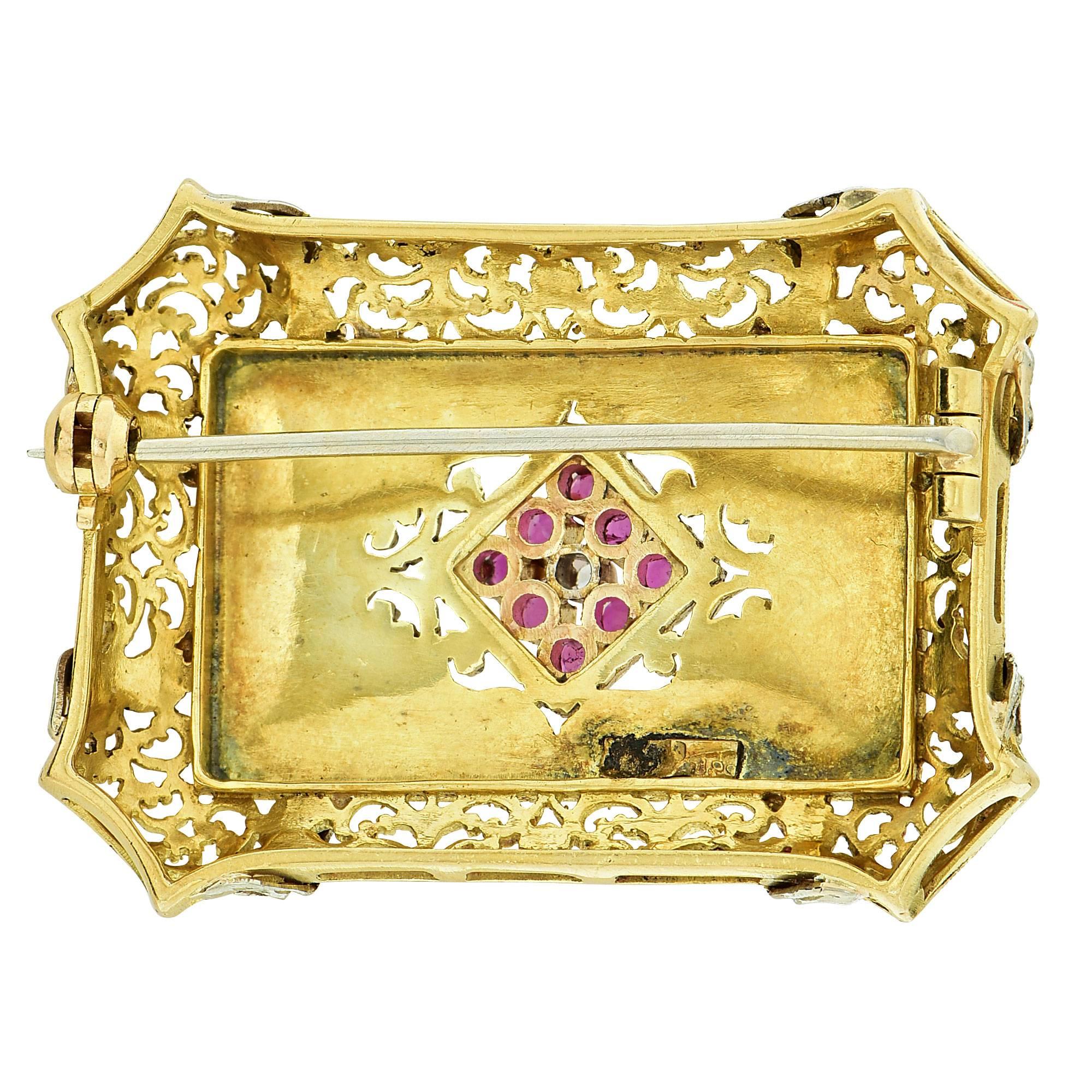 18k white and yellow gold brooch featuring 8 round rubies weighing .20cts total accented by a single cut diamond.

It is stamped and tested as 18k gold.
The metal weight is 13.99 grams.

This diamond and ruby brooch is accompanied by a retail