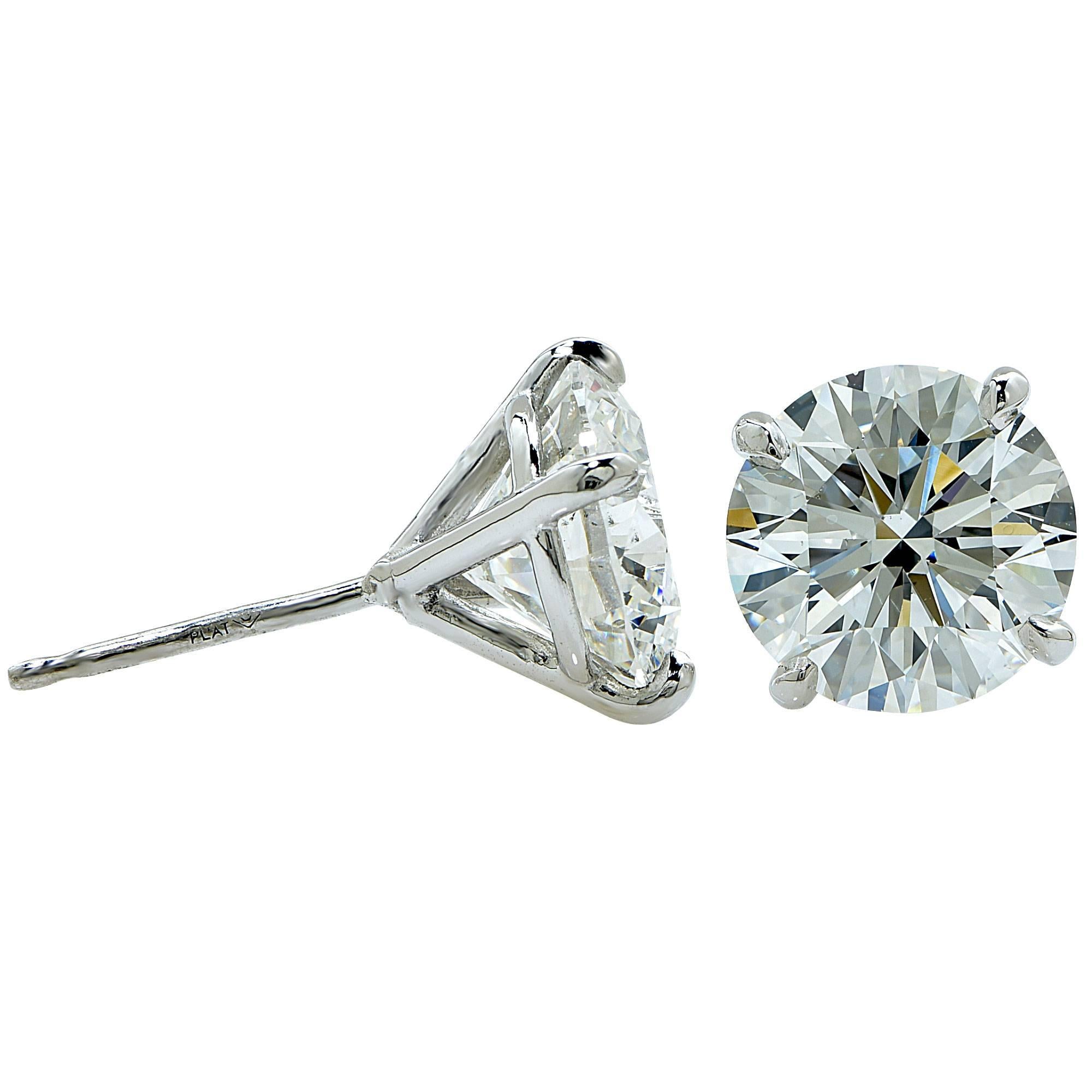 Platinum solitaire earrings featuring 2 round brilliant cut diamonds weighing 4.06cts total G color VS2 clarity GIA.

It is stamped and tested as platinum.
The metal weight is 1.55 grams.

These diamond earrings are accompanied by two GIA reports as