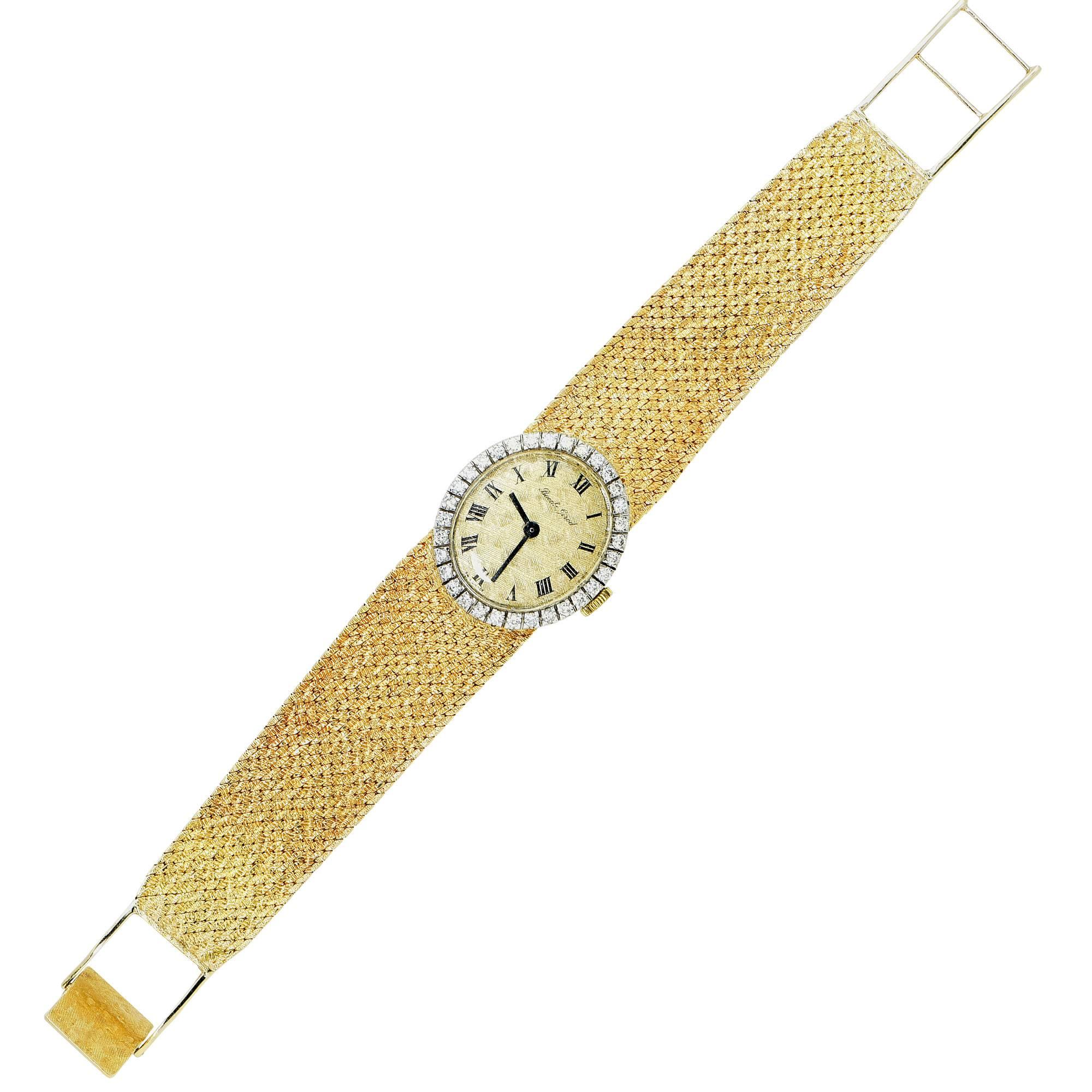 White and yellow gold Bueche Girod watch featuring 32 round brilliant cut diamonds weighing approximately .80cts total, G color VS clarity.

It is stamped and tested as 18k gold.
The metal weight is 49.44 grams.

This diamond ring is accompanied by