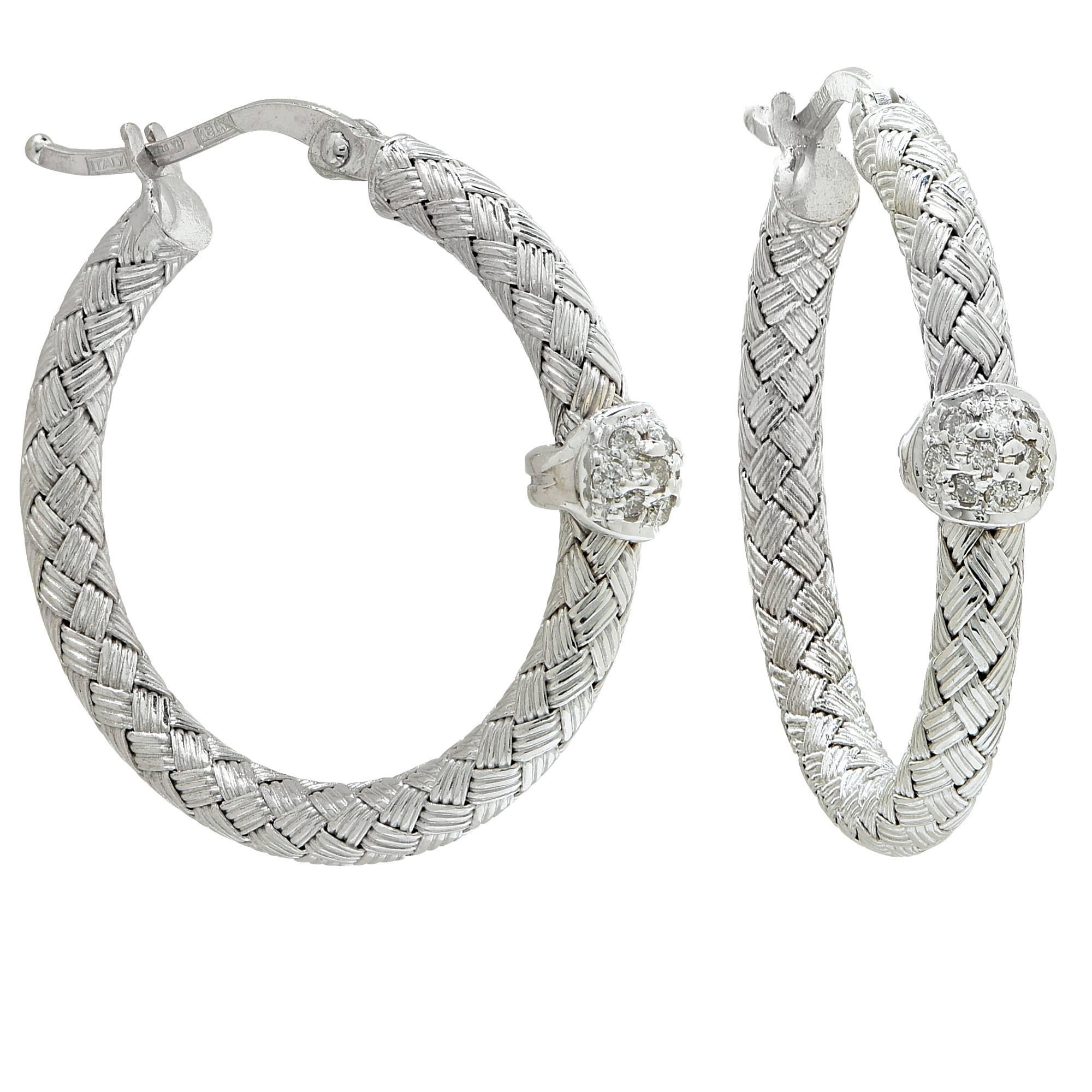 18K White gold hoop earrings contating 20 round brilliant cut diamonds weighing approximately .20cts.

The beautiful hoops were made in Italy and measure approximately 1 inch in diameter.
It is stamped and tested as 18k gold.
The metal weight is