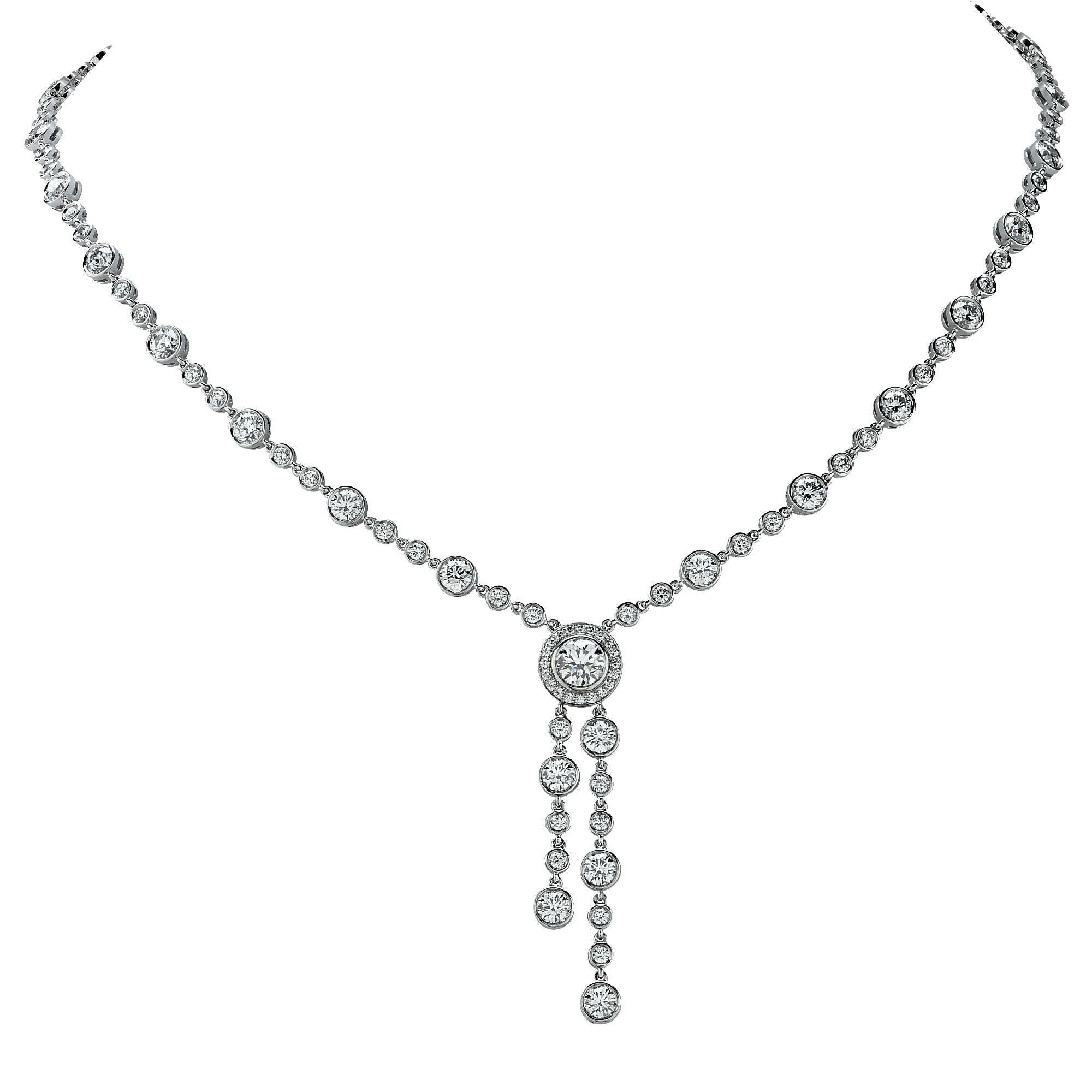 Platinum Tiffany & Co. double drop diamond necklace featuring a .70ct diamond G color and VS1 clarity surrounded by 111 rounded brilliant cut diamonds weighing 7.68ct G-H color and VS1-2 clarity bead and bezel set. The total diamond weight is