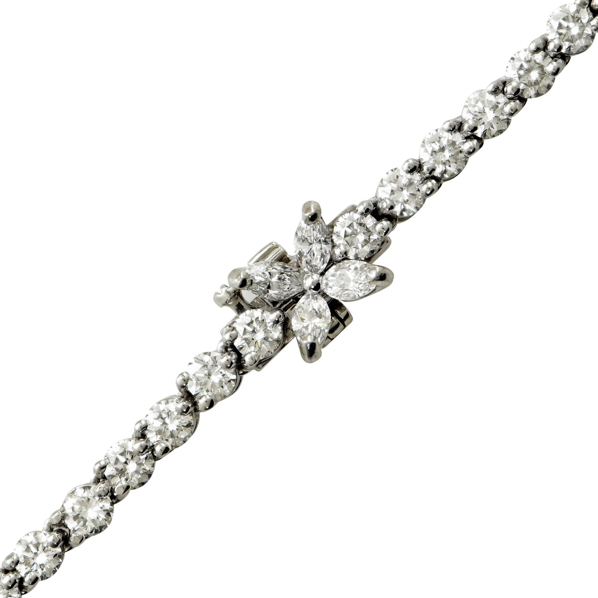 This stunning platinum Tiffany & Co. necklace from the Victoria collection features 95 round brilliant cut diamonds weighing approximately 15cts F color and VS1 clarity. The clasp contains 4 marquise cut diamonds weighing approximately .50cts F