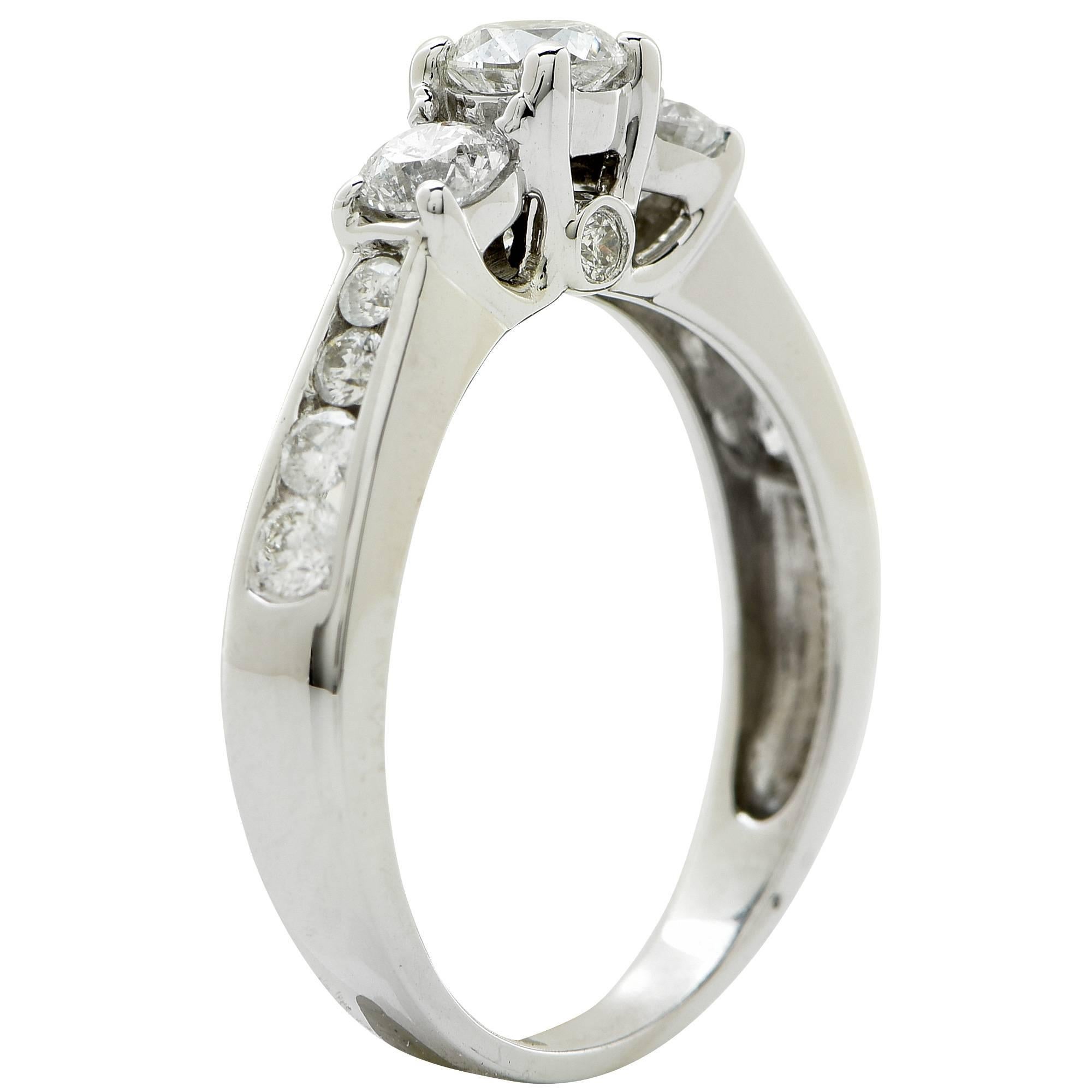 14k white gold engagement ring featuring 13 round brilliant cut diamonds weighing .96cts total, G color SI clarity.

The ring is a size 6 and can be sized up or down.
It is stamped and/or tested as 14k gold.
The metal weight is 3.28 grams.

This