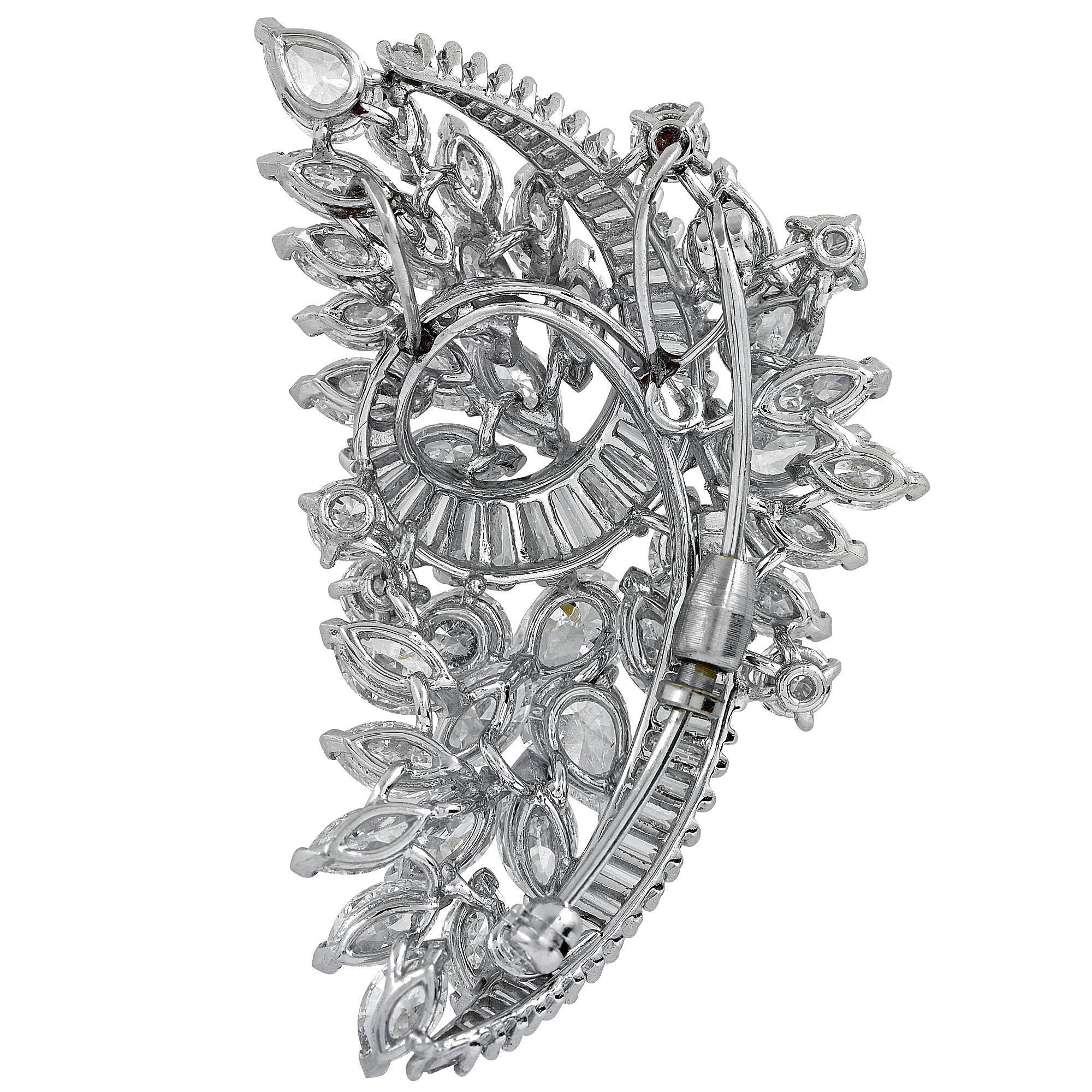 Platinum brooch featuring baguette, pear and marquise cut diamonds weighing approximately 15cts total F-G color VS clarity.

It is stamped and/or tested as platinum.
The metal weight is 21.30 grams.

This diamond brooch is accompanied by a retail