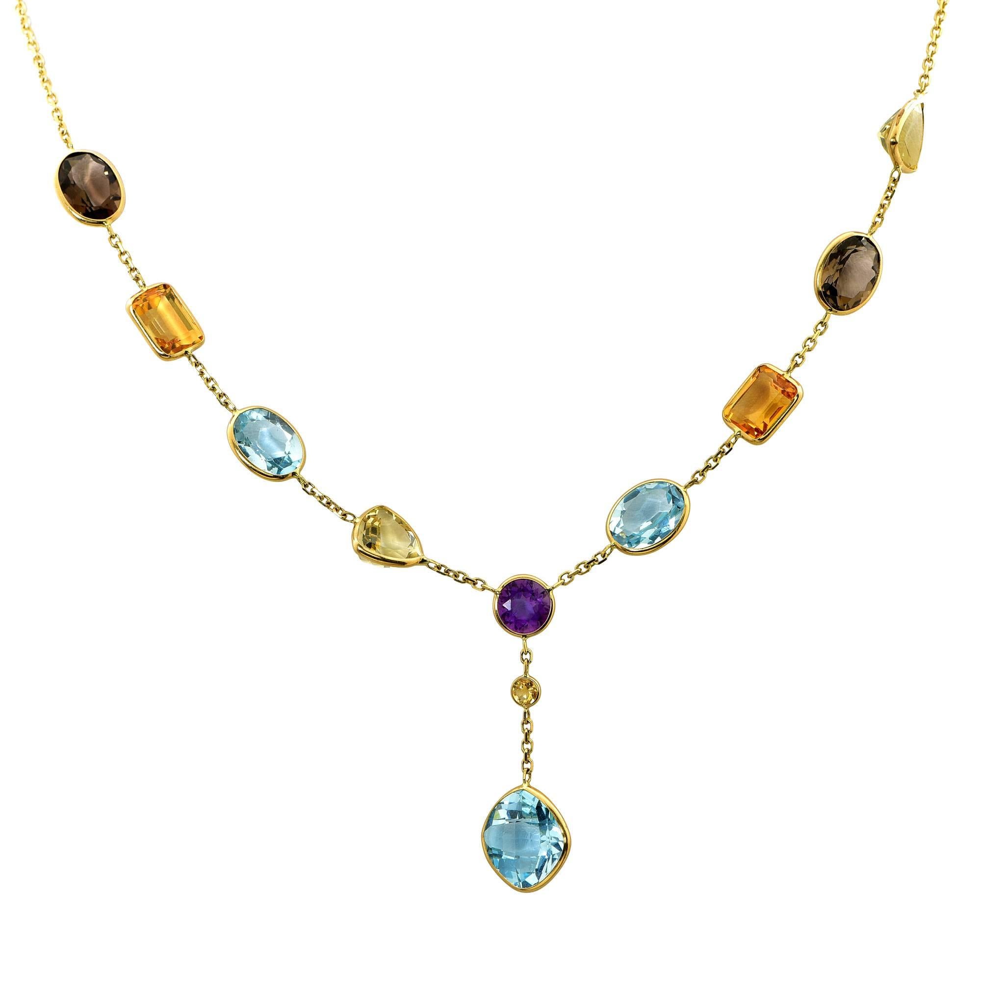 14k yellow gold lariat style necklace containing 10 mixed color semi-precious gemstones.

It is stamped and/or tested as 14k gold.
The metal weight is 6.91 grams.

This necklace is accompanied by a retail appraisal performed by a GIA Graduate