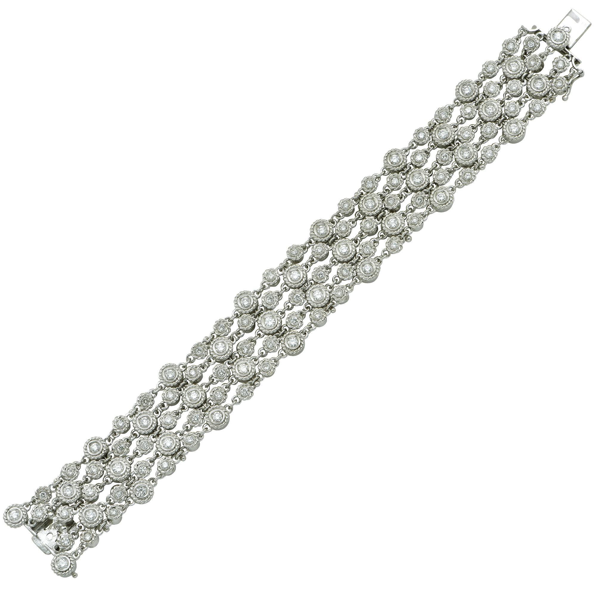 18k white gold flexible bracelet featuring 105 round brilliant cut diamonds weighing approximately 4.20cts total, G color VS clarity.

The bracelet measures 7.50 inches in length.
It is stamped and/or tested as 18k gold.
The metal weight is 65.46