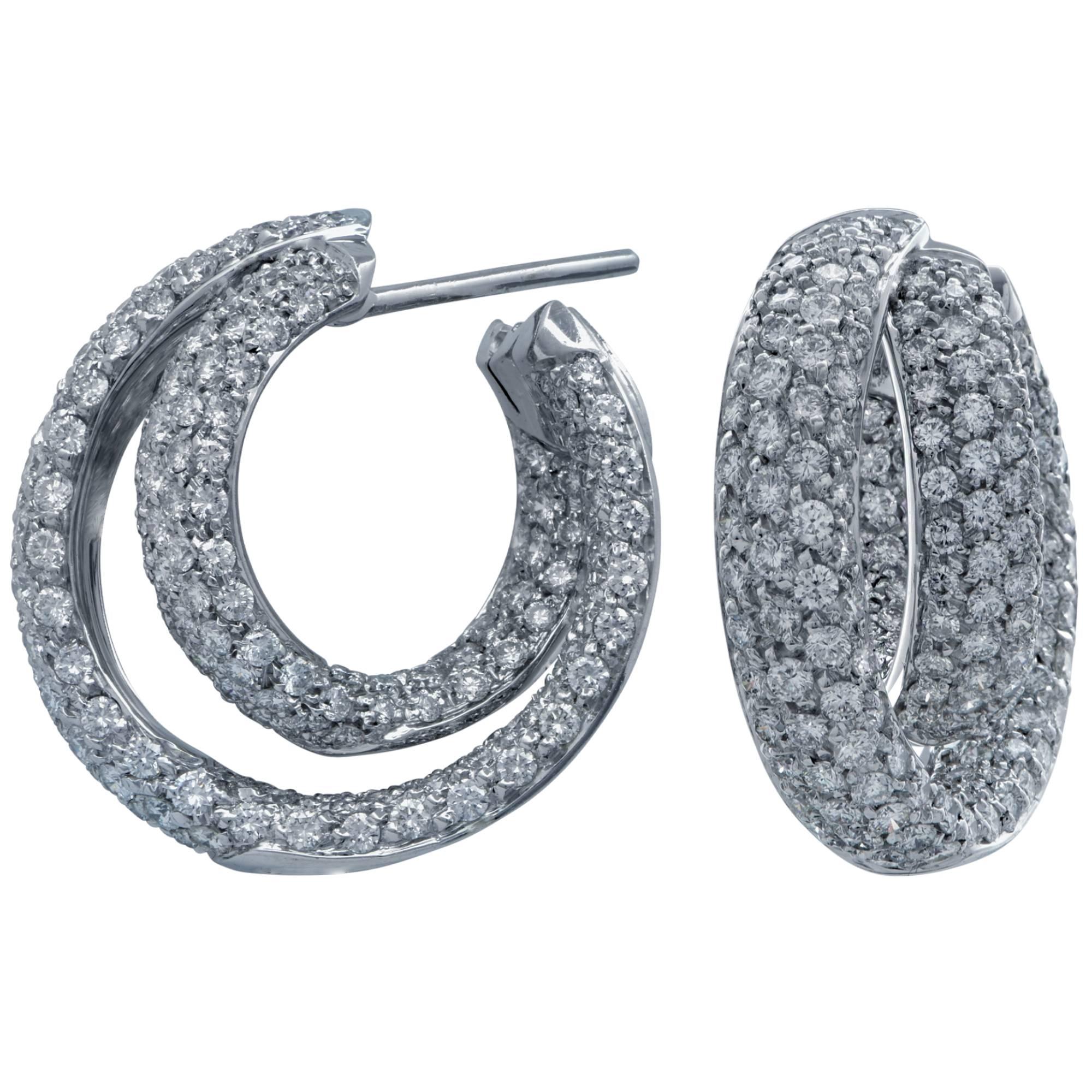 18k white gold hoop earrings featuring 380 round brilliant cut diamonds weighing approximately 7.50cts total G color VS clarity.

They are stamped and/or tested as 18k gold.
The metal weight is 17.88 grams.

These diamond earrings are accompanied by