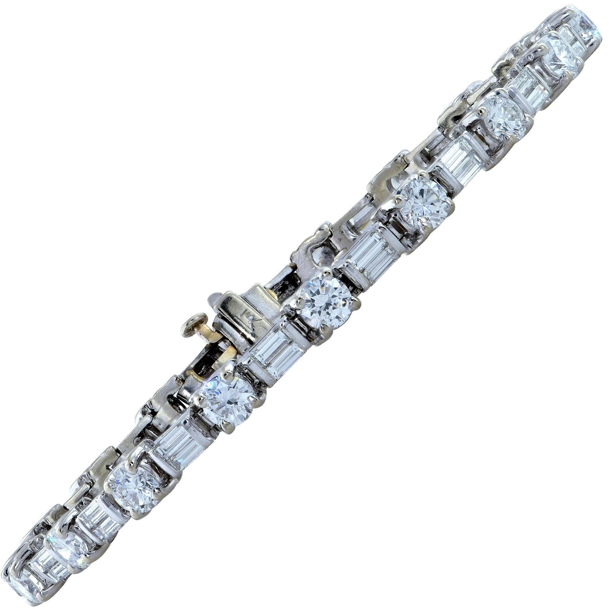 14k white gold bracelet containing 19 round brilliant cut diamonds weighing approximately 5cts and 38 straight baguettes weighing approximately 2cts. All diamonds are F-G color and VS-SI clarity.

This bracelet measure 7.75 inches.
It is stamped