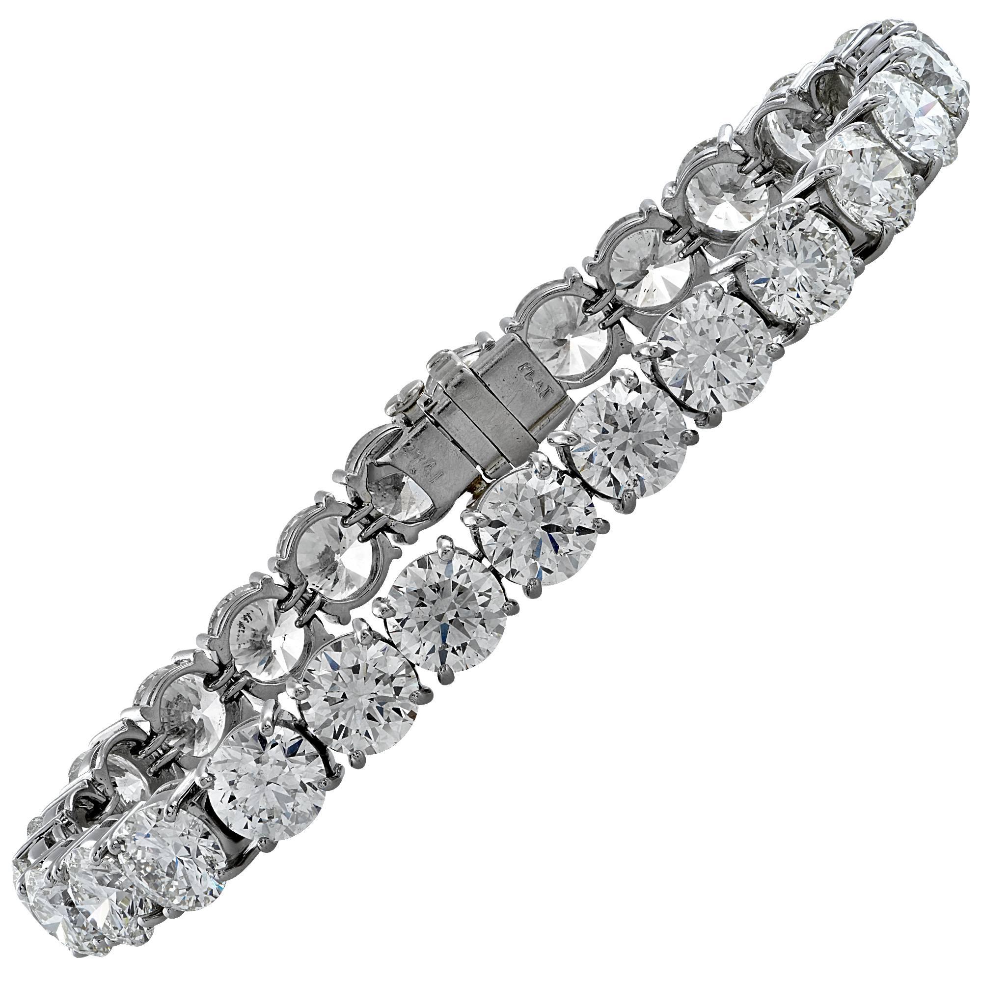 Platinum bracelet containing 27 round brilliant cut diamonds weighing 27.97ct.

This bracelet measures 7 inches.
It is stamped and/or tested as platinum.
The metal weight is 26.59 grams.

This diamond bracelet is accompanied by a retail appraisal