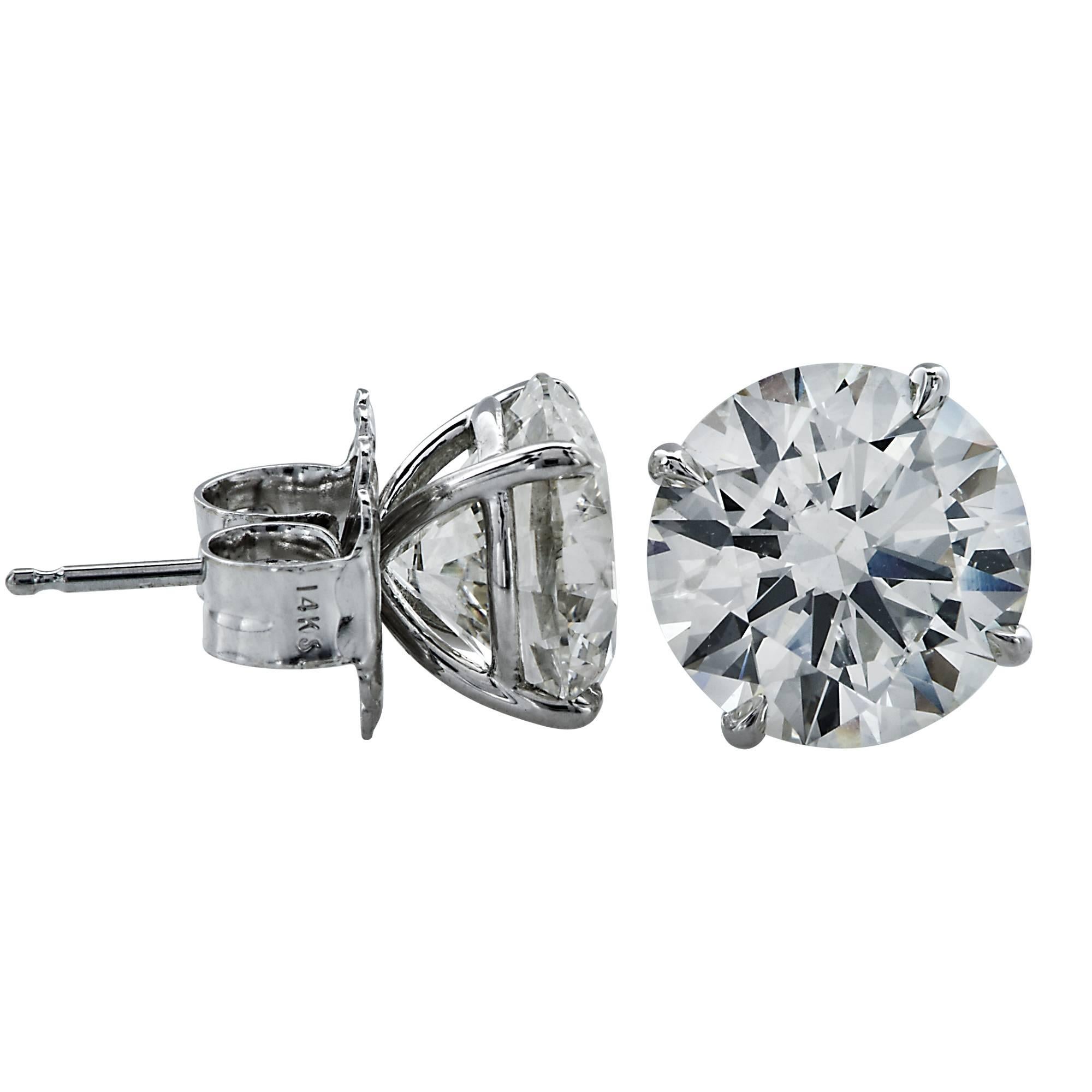 18k white gold earrings containing two GIA graded round brilliant cut diamonds with a combined total weight of 6.92ct L color and SI2 clarity.

The earrings are stamped and/or tested as 18k gold.

These diamond earrings are accompanied by two GIA