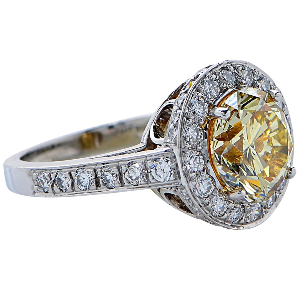 3.36 Carat GIA Graded Fancy Yellow Diamond Platinum Engagement Ring In Excellent Condition For Sale In Miami, FL