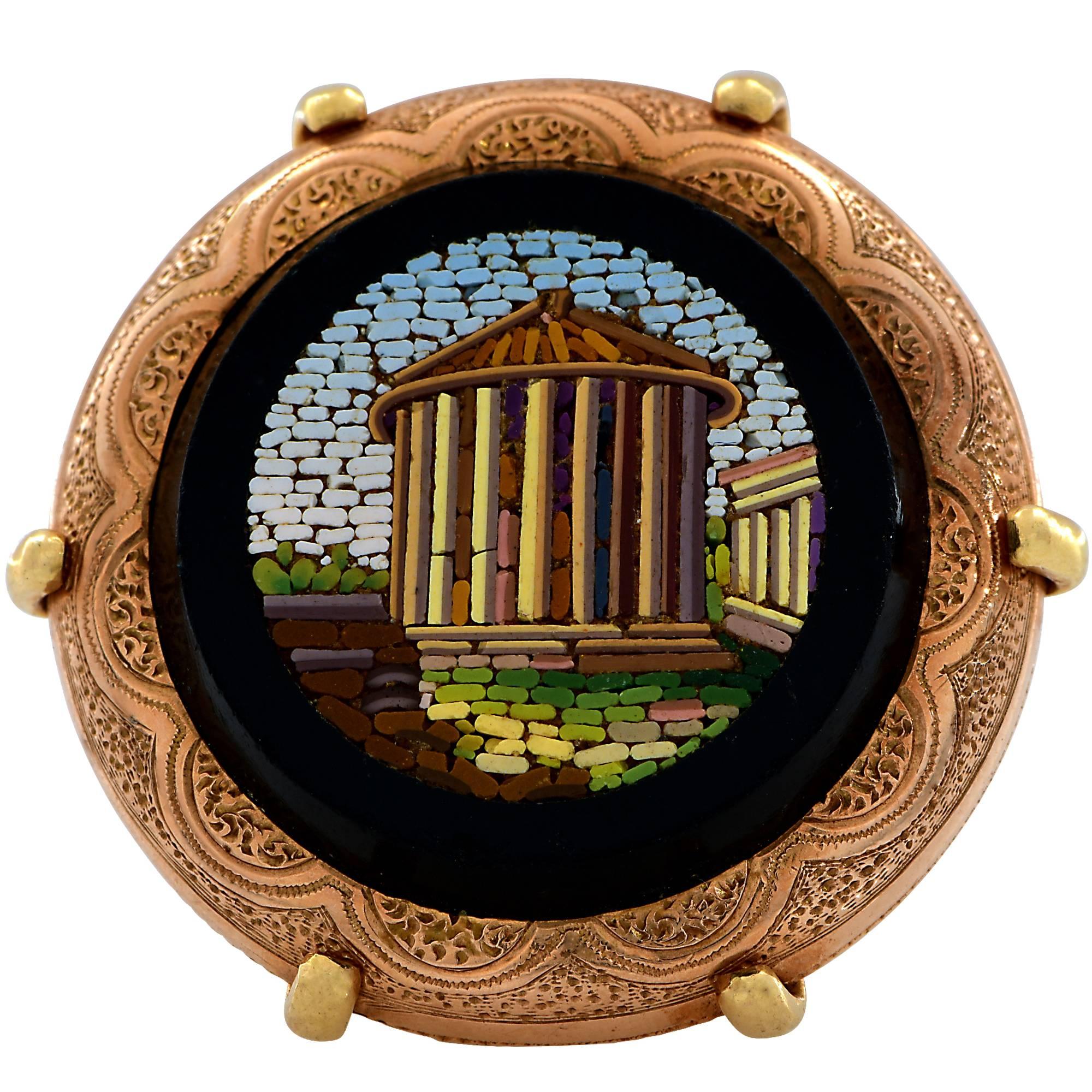 Victorian micro mosaic ring depicting an ancient Roman scene, surrounded by black onyx, measuring 1.2 inches in diameter.

The ring is currently a size 8 and can be sized up or down.
It is stamped and/or tested as 14k gold.
The metal weight is 19.59