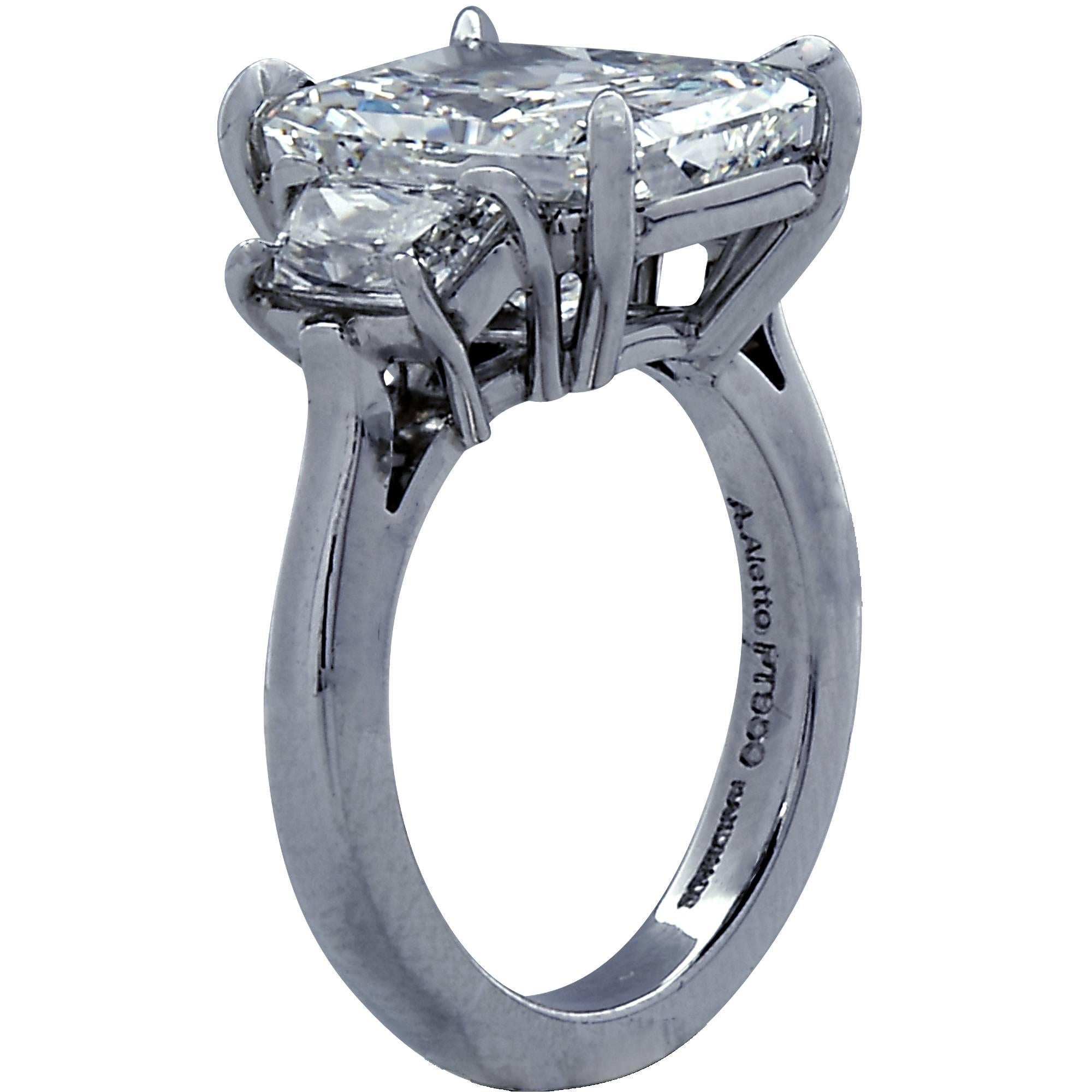 Platinum handmade ring featuring a GIA graded 5.55ct rectangular radiant cut diamond I color and SI1 clarity flanked by 2 trapezoid brilliant cut diamonds weighing 1.13ct.

The ring is a size 5 and can be sized up or down.
It is stamped and/or