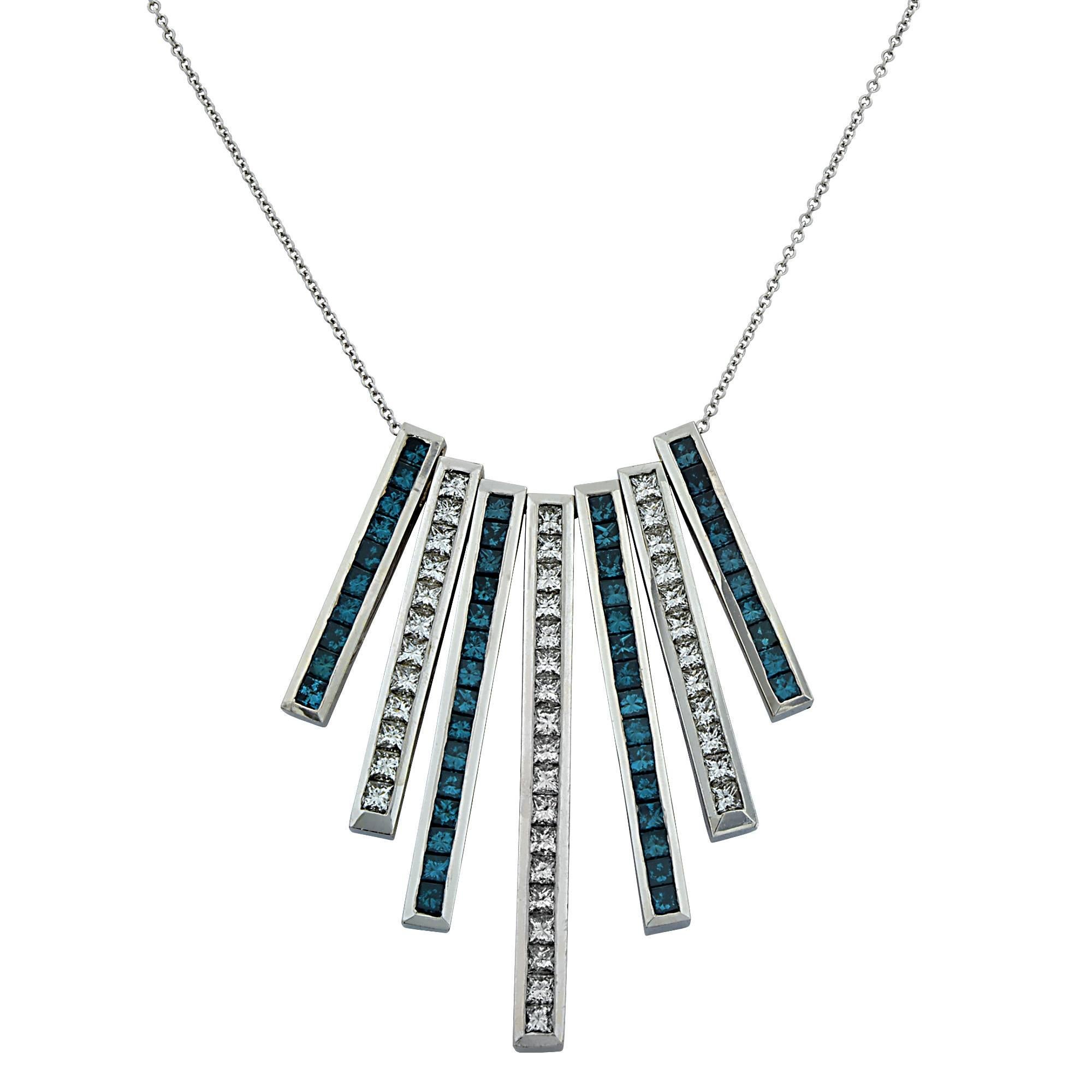 18k white gold necklace containing 42 princess cut diamonds weighing approximately 4.20cts G-H color and VS clarity as well as 50 color enhanced blue princess cut diamonds weighing approximately 3.50cts VS-SI clarity.

The necklace measures 16