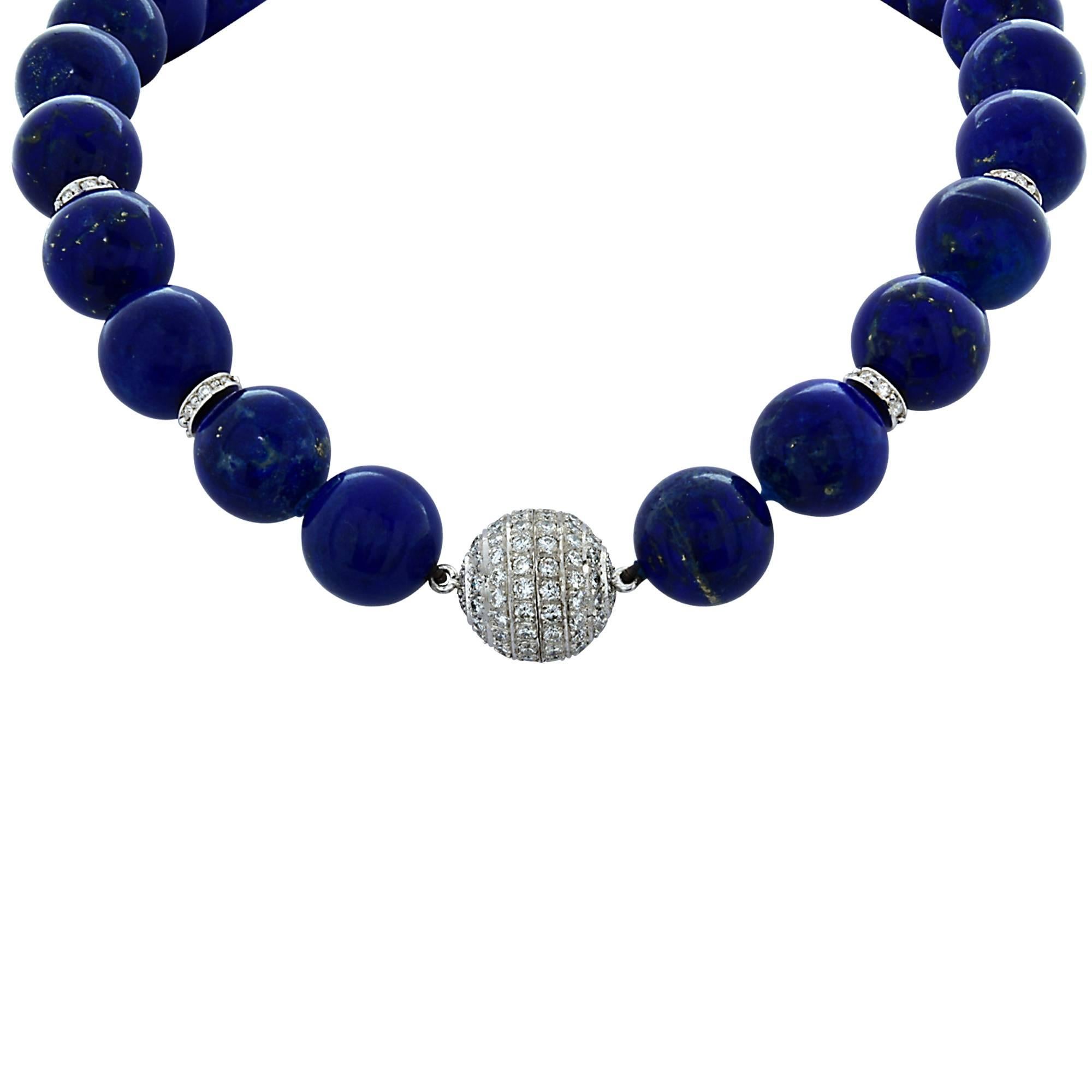 This exquisite lapis lazuli necklace features a magnificently crafted diamond clasp and rhondells. The diamond clasp and rondells are studded with 138 sparkly and lively round brilliant cut diamonds weighing 4.70cts total, VS1-2 clarity, G color.